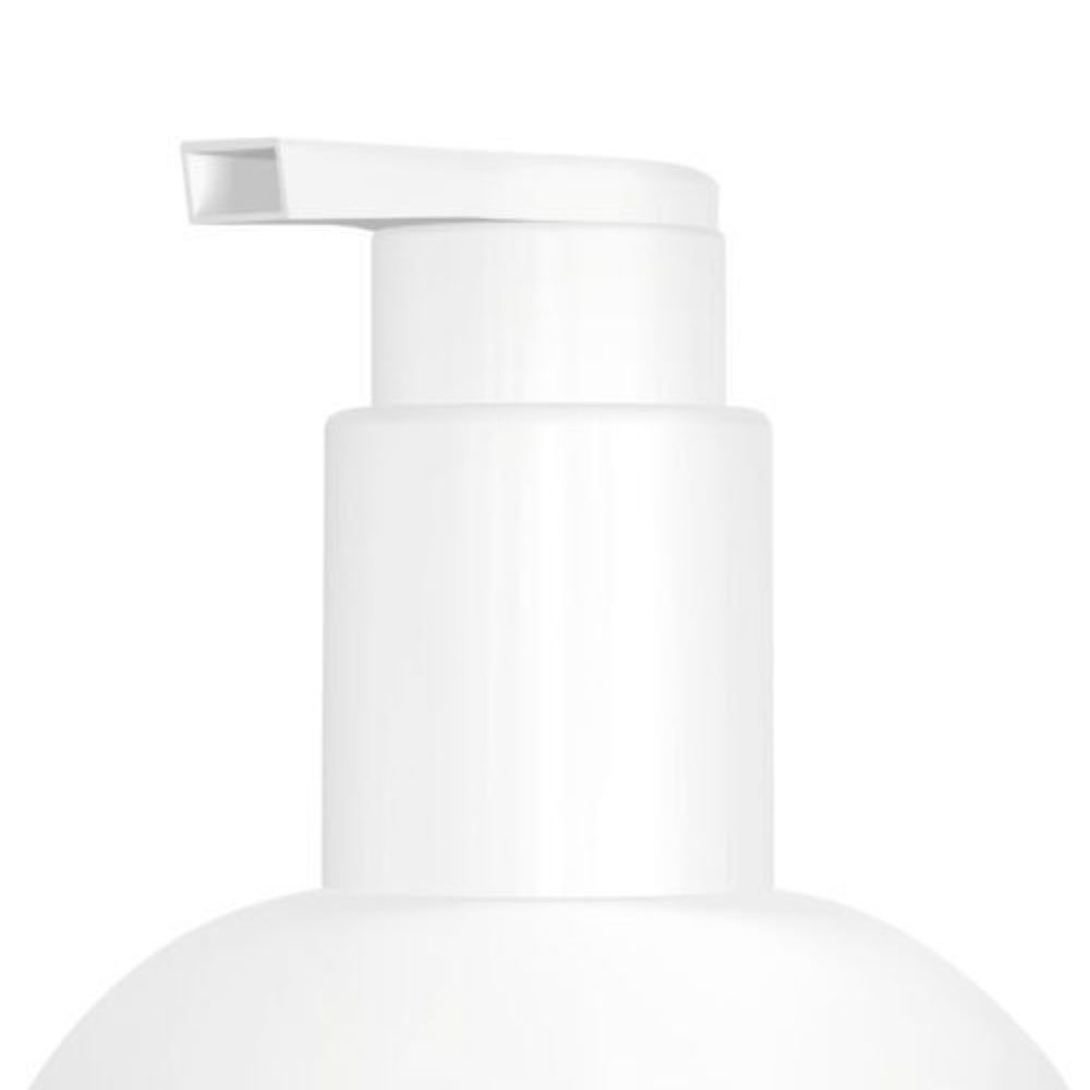 Close-up van de pompkop van een witte fles.