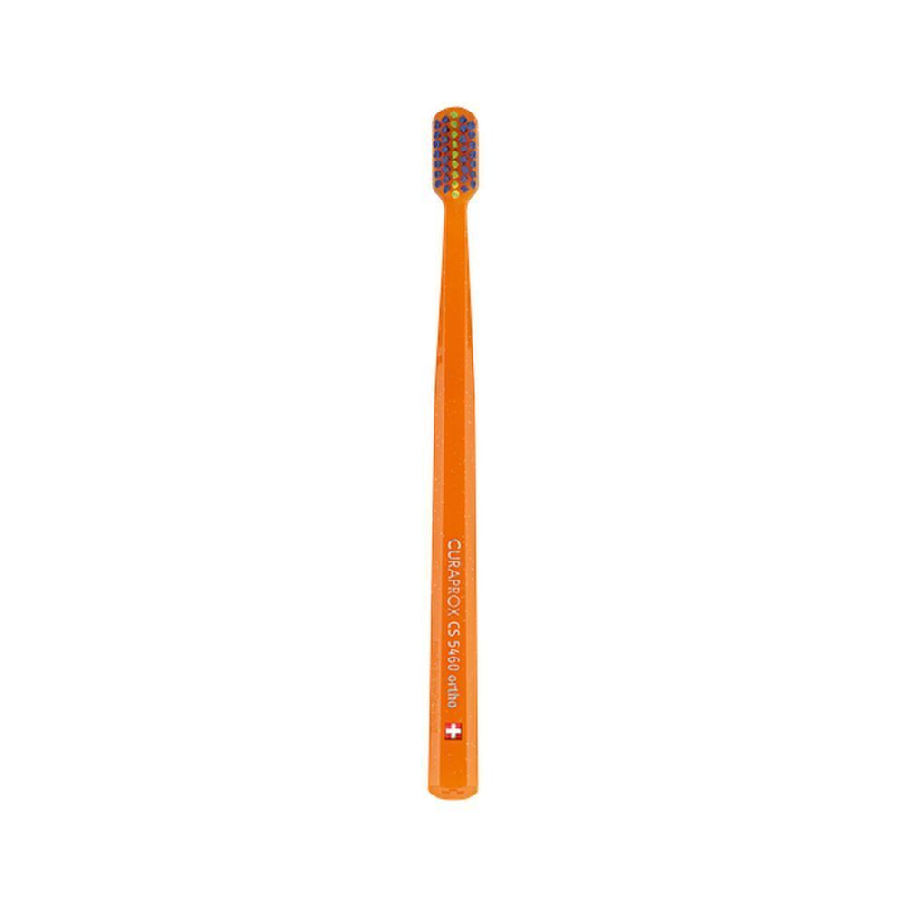 Emballage de brosse à dents. Blanc, texte et illustrations. Marque: Curaden. Fabriqué en Suisse. Code QR.