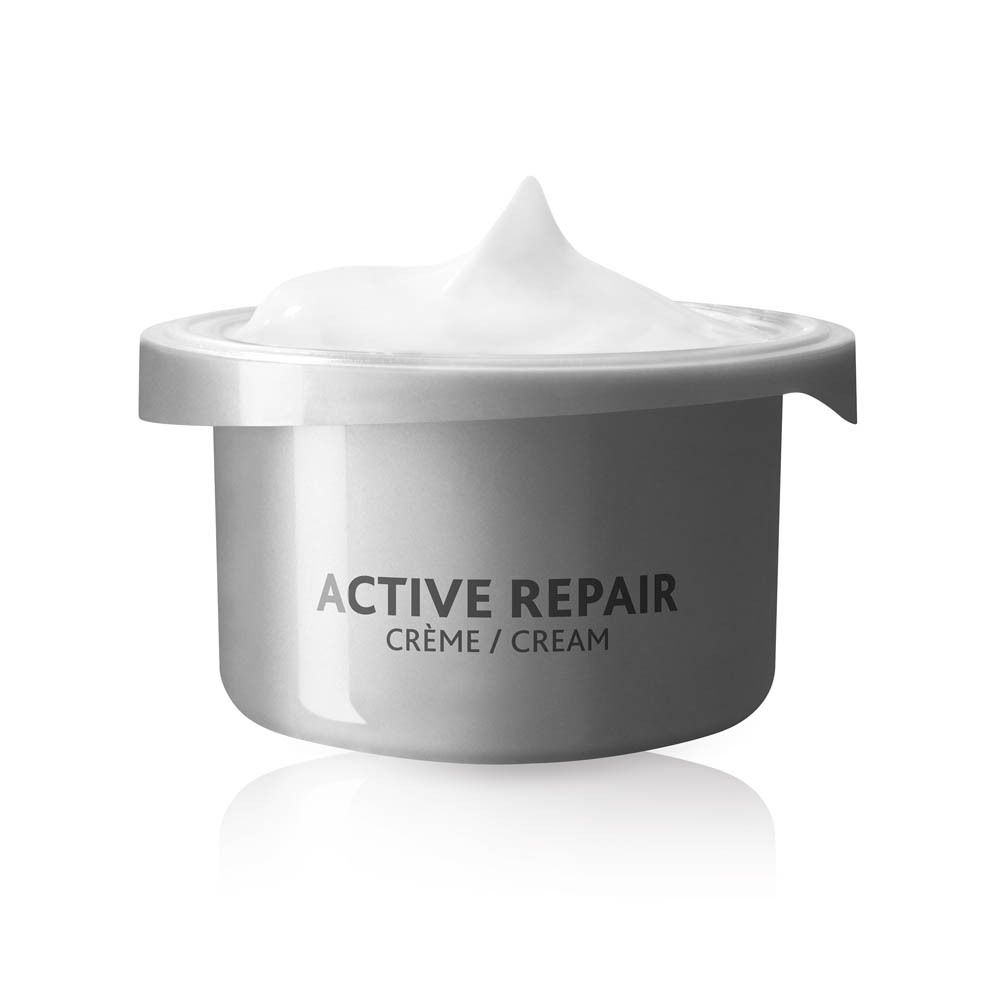 Pot de crème avec crème. Active Repair Crème/Cream. Produit blanc, contenant argenté.