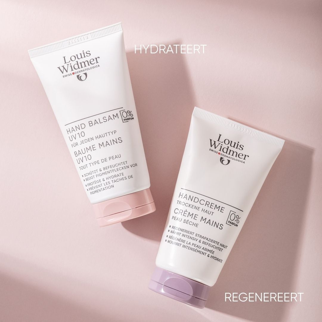 Twee handcrèmetubes. Opschrift: Louis Widmer, Handcreme en Handbalsem UV10. Paarse en roze doppen.