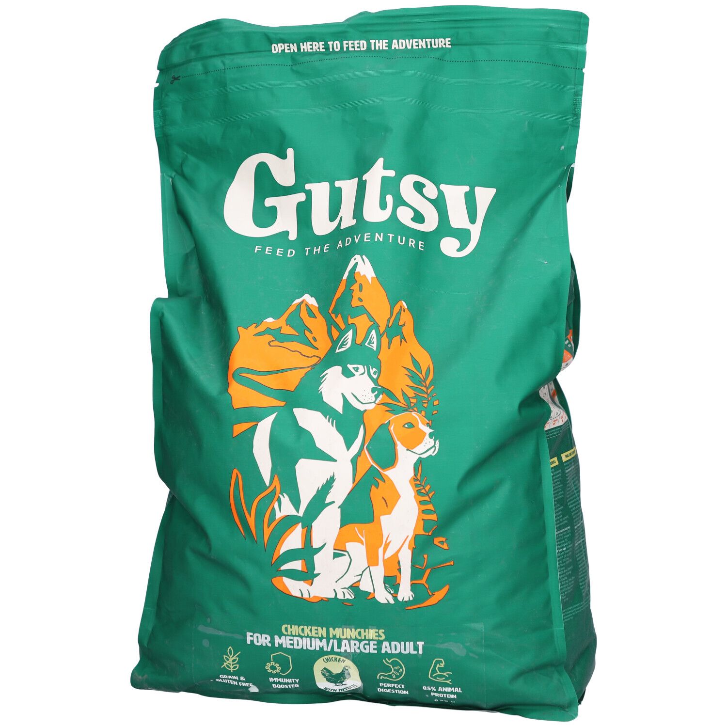 Sac vert Gutsy avec logo et chiens. Texte: Chicken Munchies pour chiens moyens/grands. Fermeture éclair en haut.