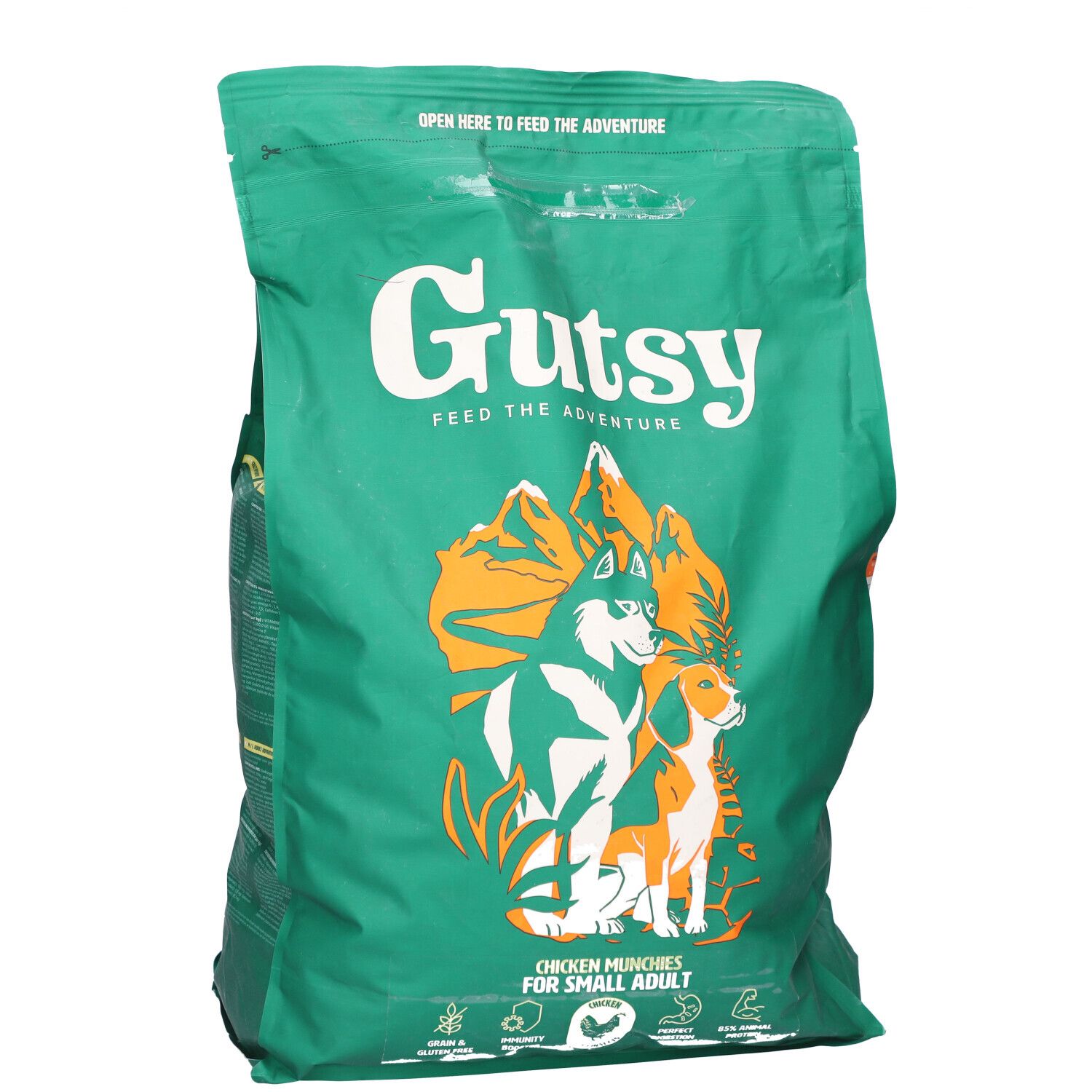 Sac vert avec impression. Contient de la nourriture pour chiens. Inscription : Gutsy, Chicken Munchies pour petits chiens. Illustration de chien et loup.