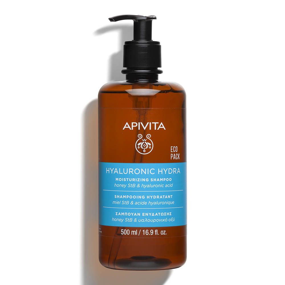 Bruine fles met zwarte pomp. Opschrift: Apivita Hyaluronic Hydra Moisturizing Shampoo.