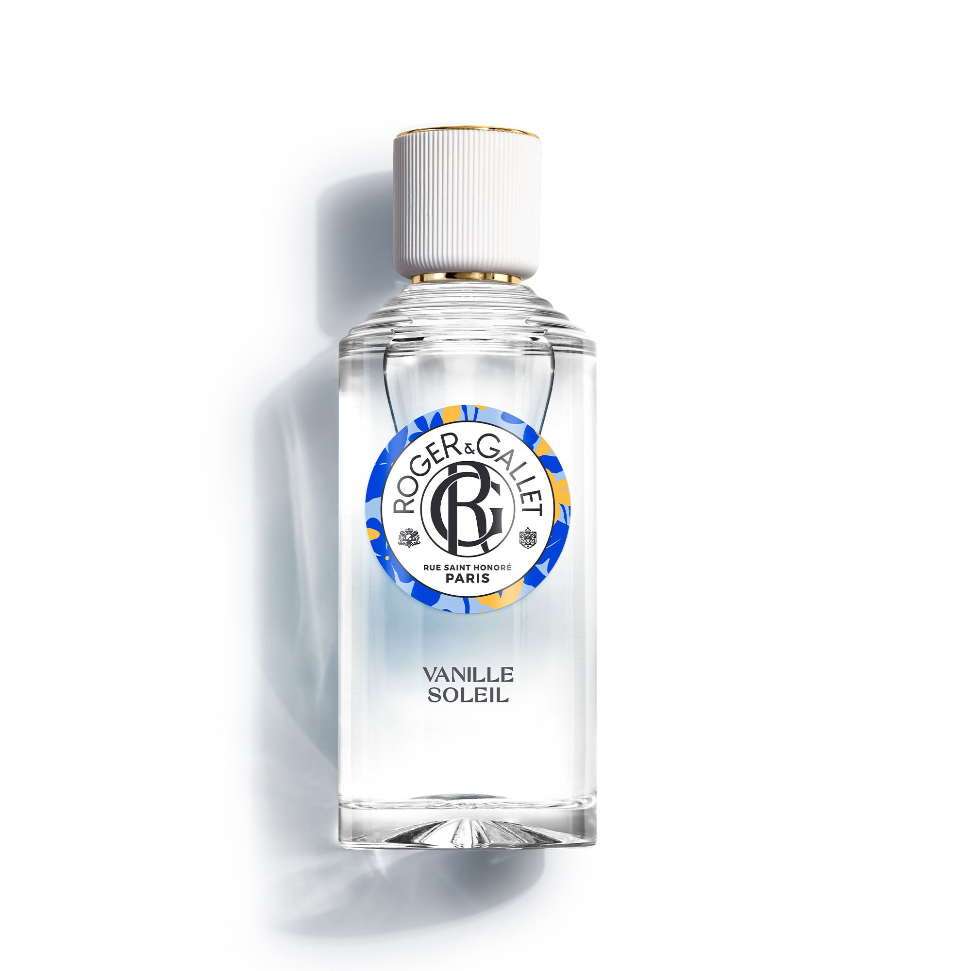 Flacon avec bouchon doré. Logo et nom du produit Vanille Soleil. Sur fond blanc.