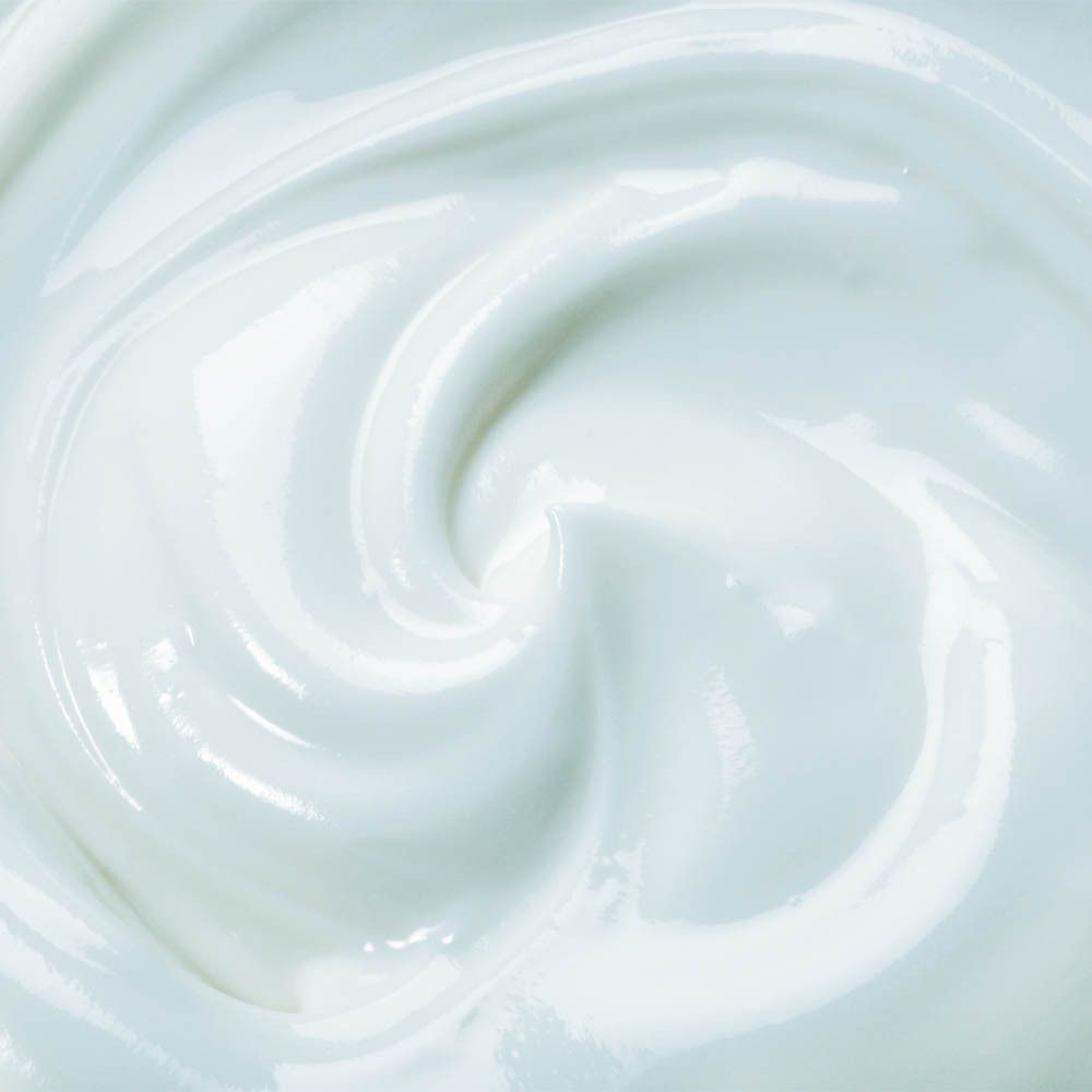 Close-up van witte crème. Romige textuur, gewerveld.