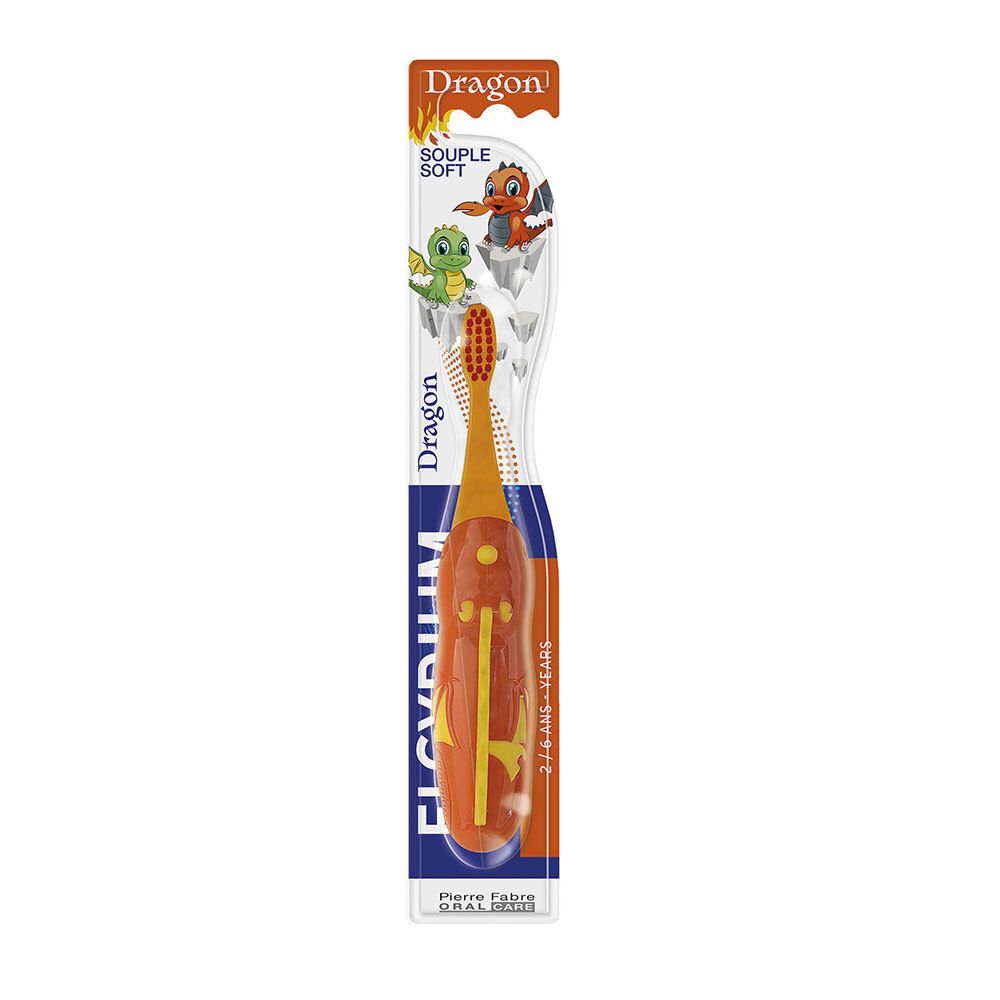 Brosse à dents enfant orange avec motif dragon. Soie souple, manche avec accents jaunes. Emballage avec nom du produit et recommandation d'âge.