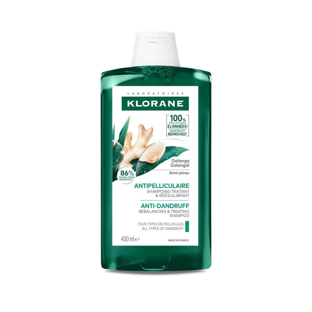 Flacon vert Klorane. Étiquette avec illustration de gingembre et mentions. 400 ml. Shampooing antipelliculaire.