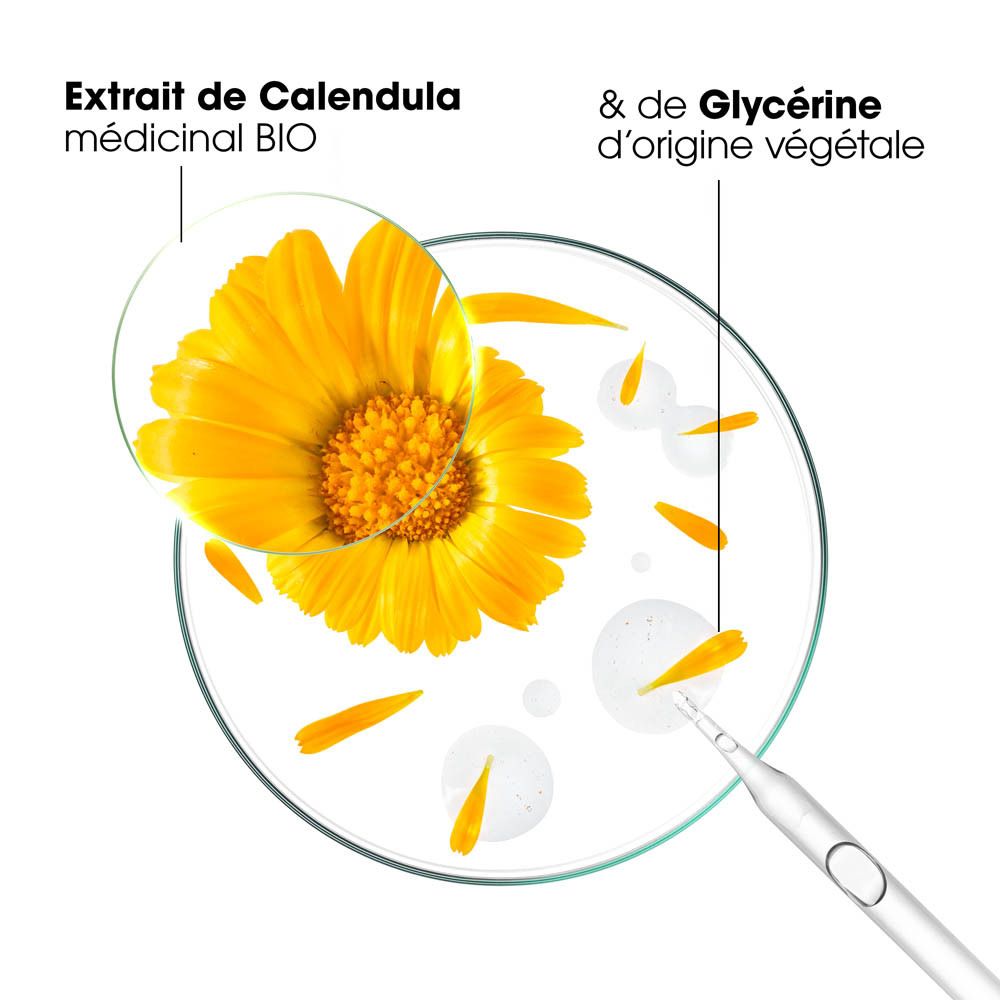 Gros plan sur des fleurs de Calendula et de la glycérine. Texte: Extrait de Calendula médicinal BIO.
