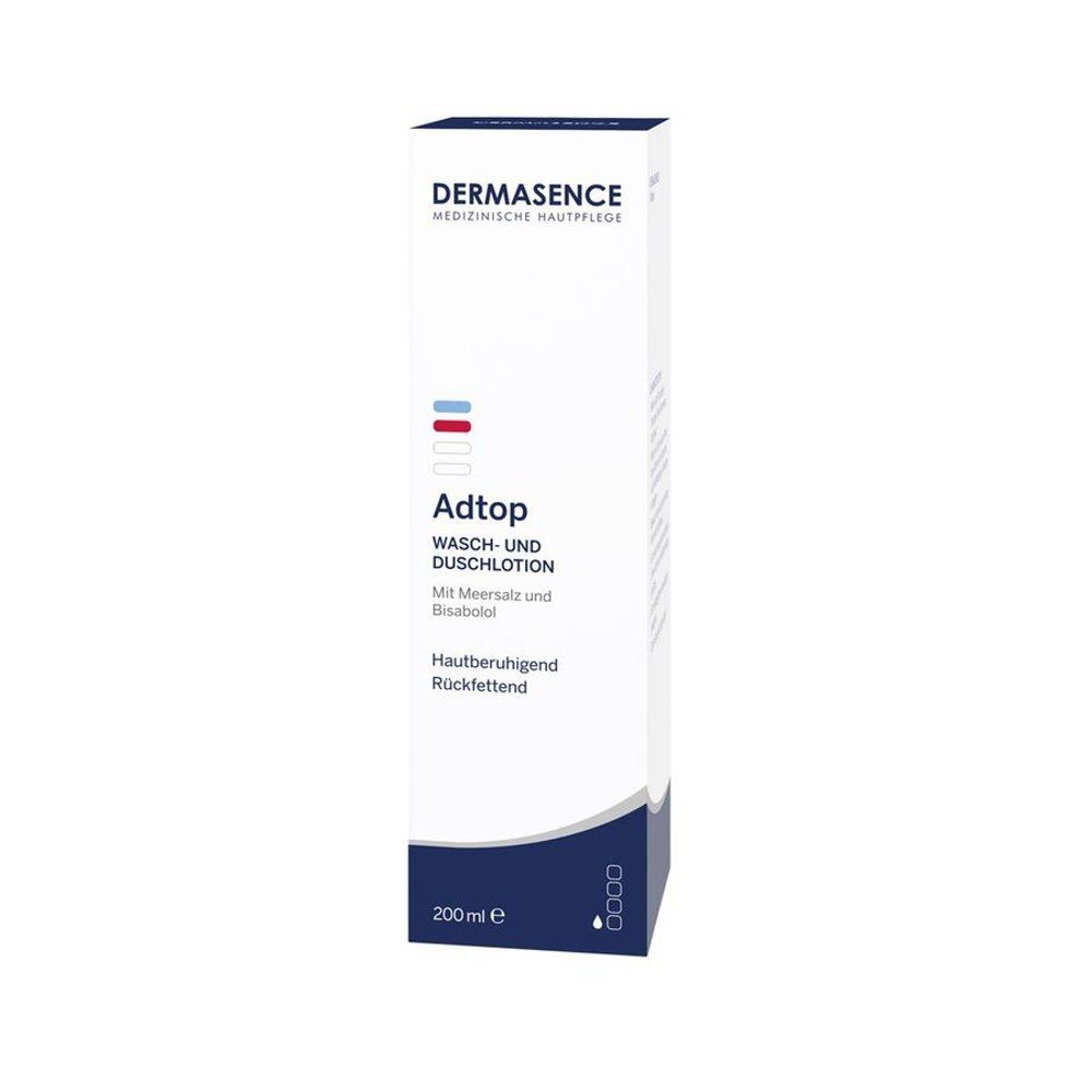 Emballage blanc avec rayures bleues et rouges. Inscription: Dermasence Adtop Lotion Bain & Douche. 200 ml.