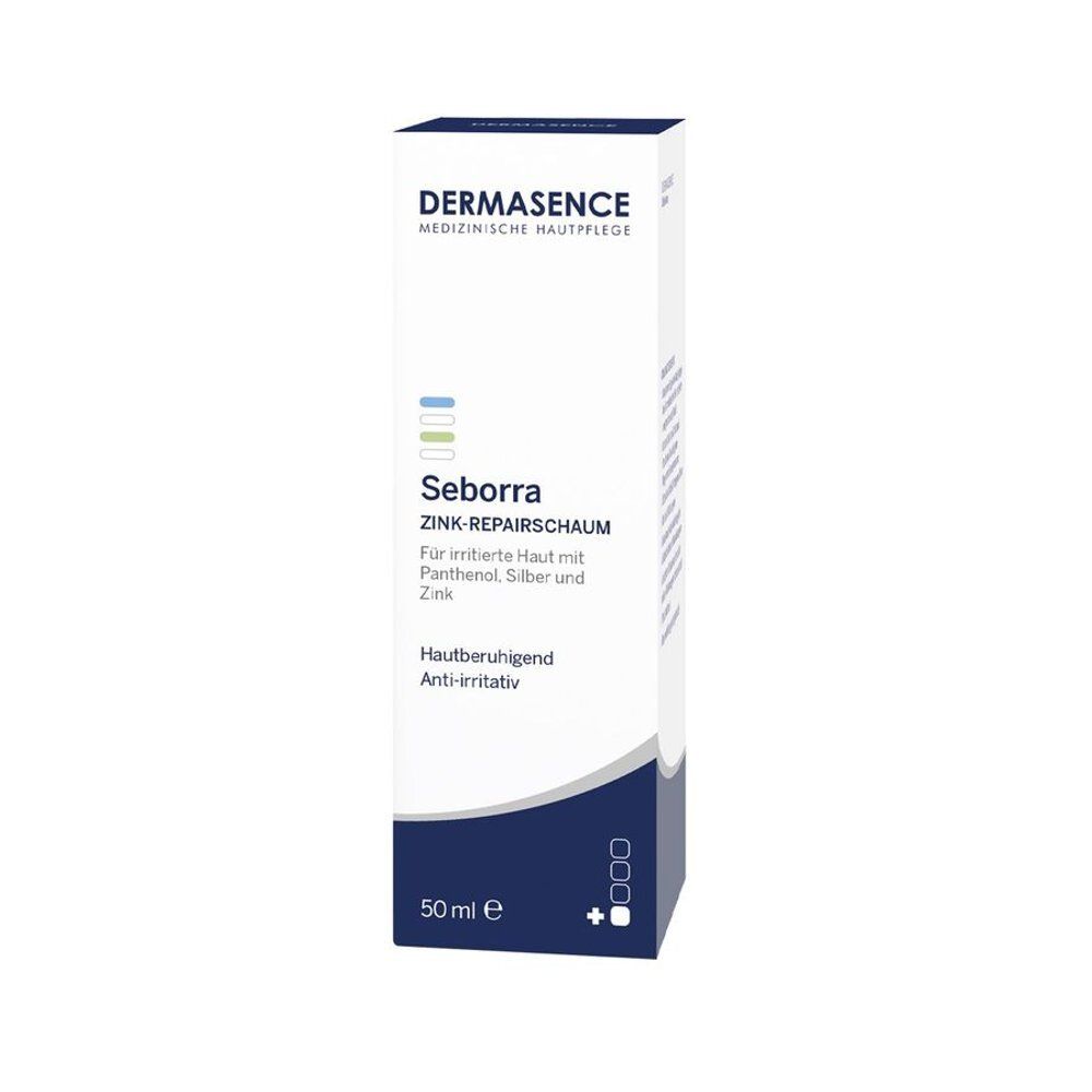 Verpakking van Dermasence Seborra Zink-Repairschaum. Wit, blauw en grijs. 50 ml.