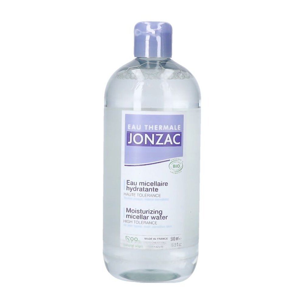 Flacon transparent avec bouchon bleu. Étiquette avec nom du produit et logo. Inscriptions en français.