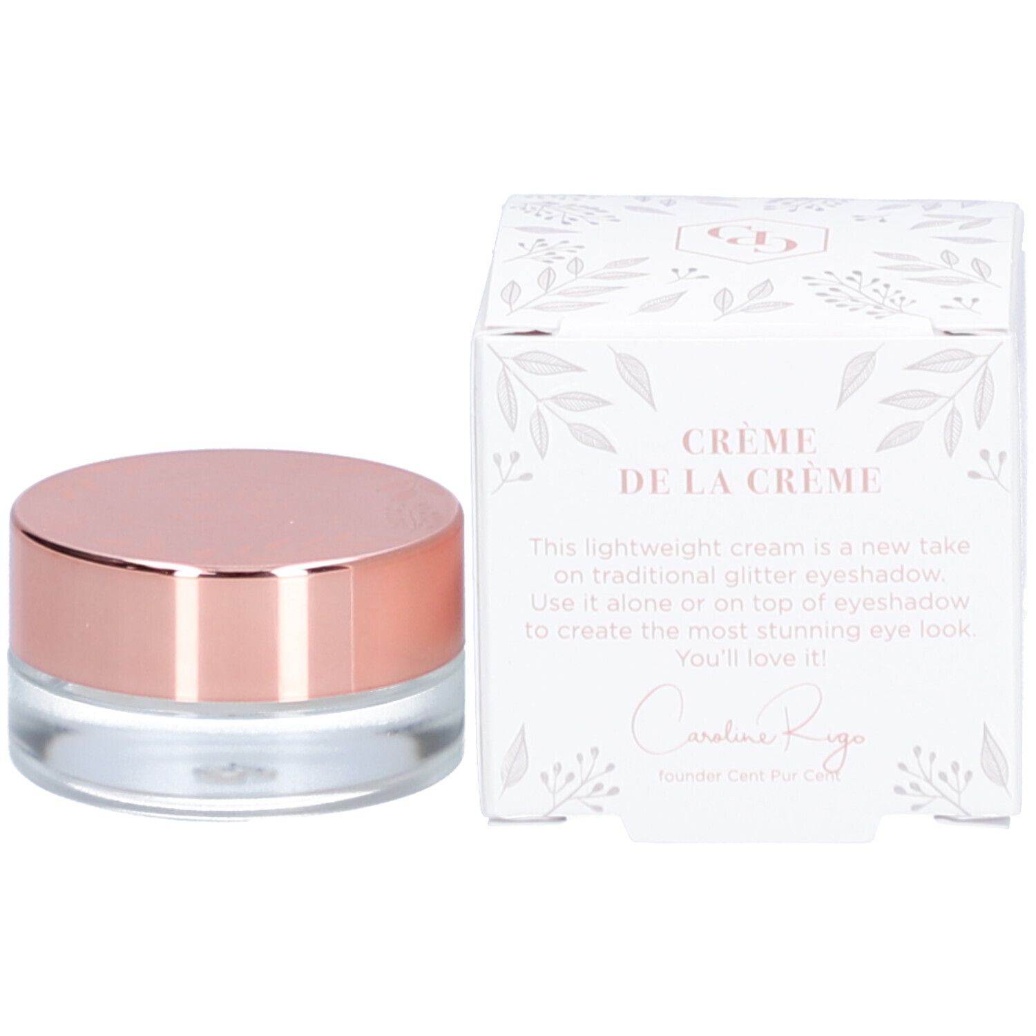 Topper crème en pot de verre avec couvercle doré rose. À côté, une boîte blanche avec motif floral et texte.