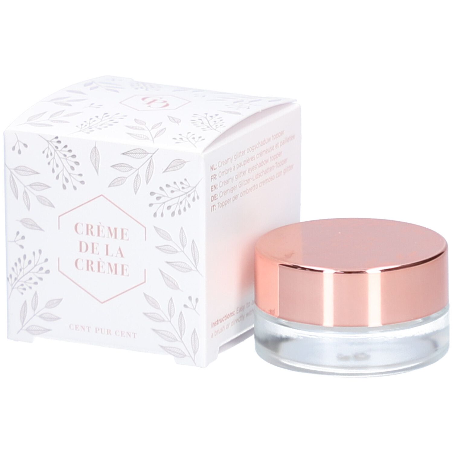 Topper crème en pot de verre avec couvercle doré rose. À côté, une boîte blanche avec motif floral et texte.
