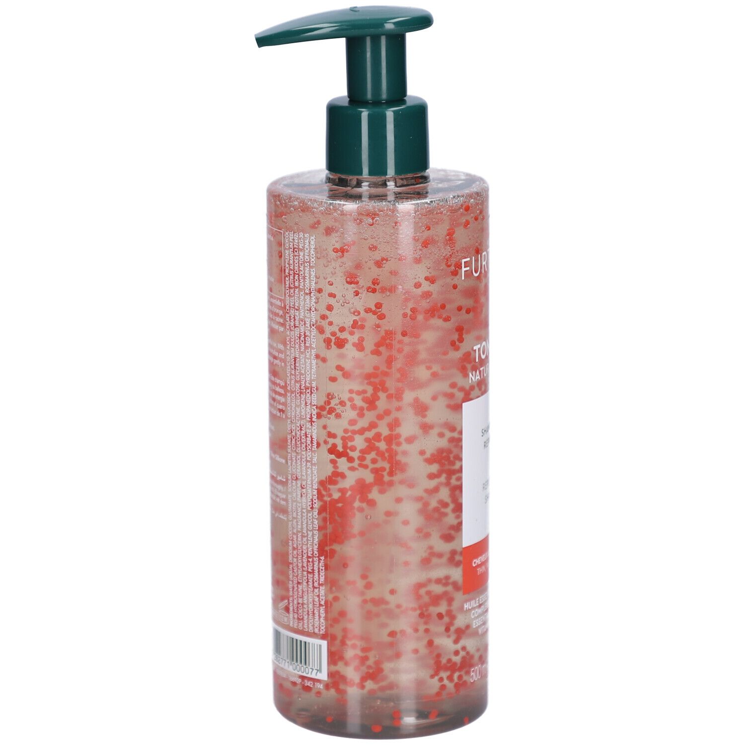 Flacon transparent avec pompe verte. Contient un liquide avec des billes rouges. Étiquette avec texte.