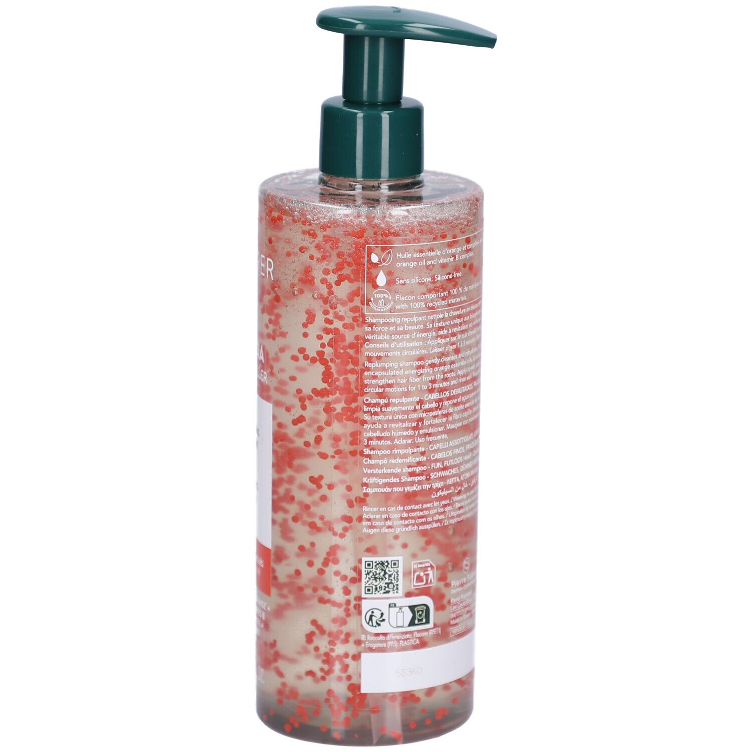 Côté d'un flacon transparent avec pompe verte. Contient un liquide avec des billes rouges. Étiquette avec texte et QR code.