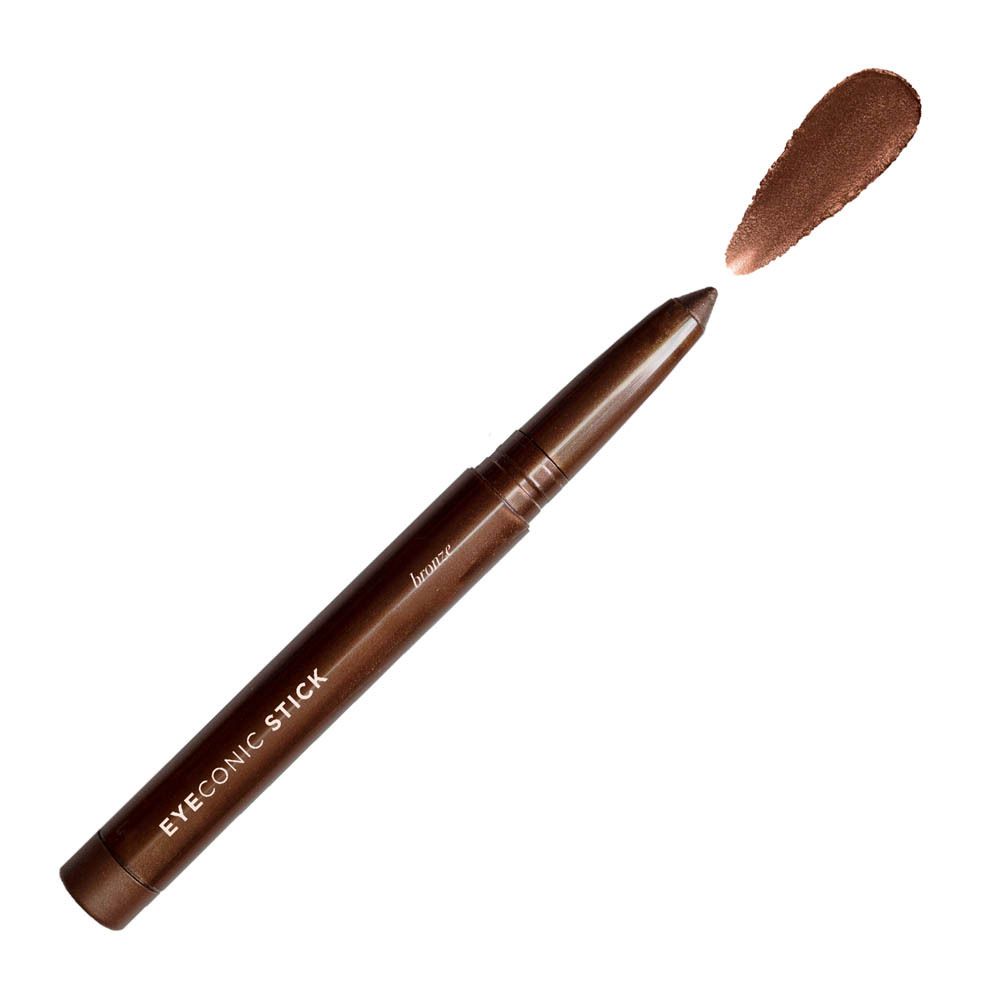Een bronzen oogschaduwstick met zilveren logo en tekst.