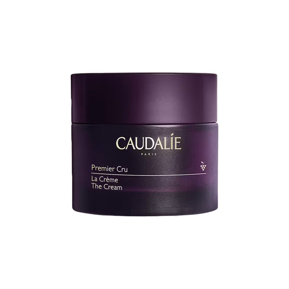 Donkerpaarse pot met deksel. Opschrift: Caudalie Premier Cru La Crème The Cream.