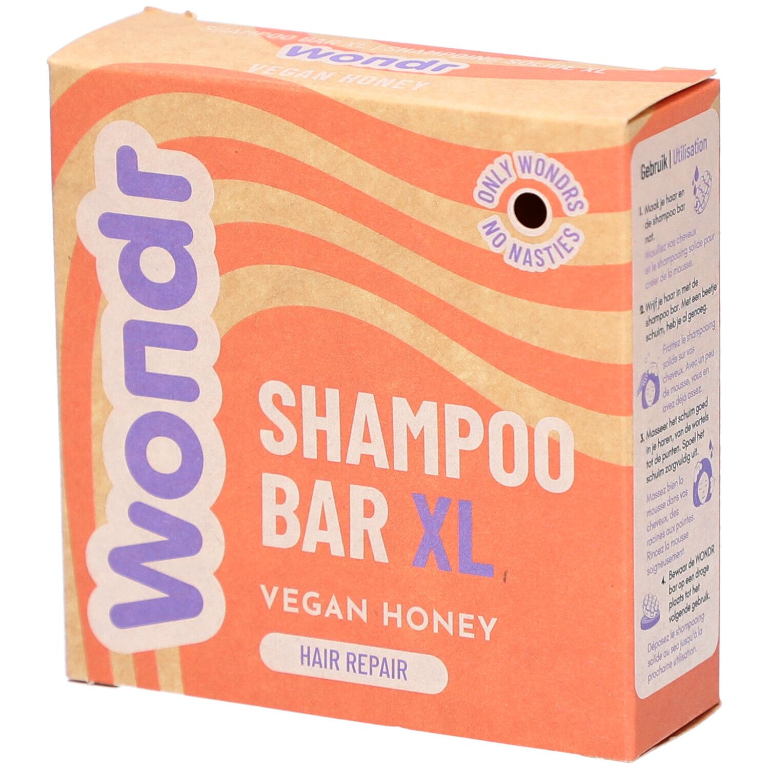 Kartonnen verpakking met Wondr, Shampoo Bar XL, Vegan Honey. Oranje en beige golfachtergrond.