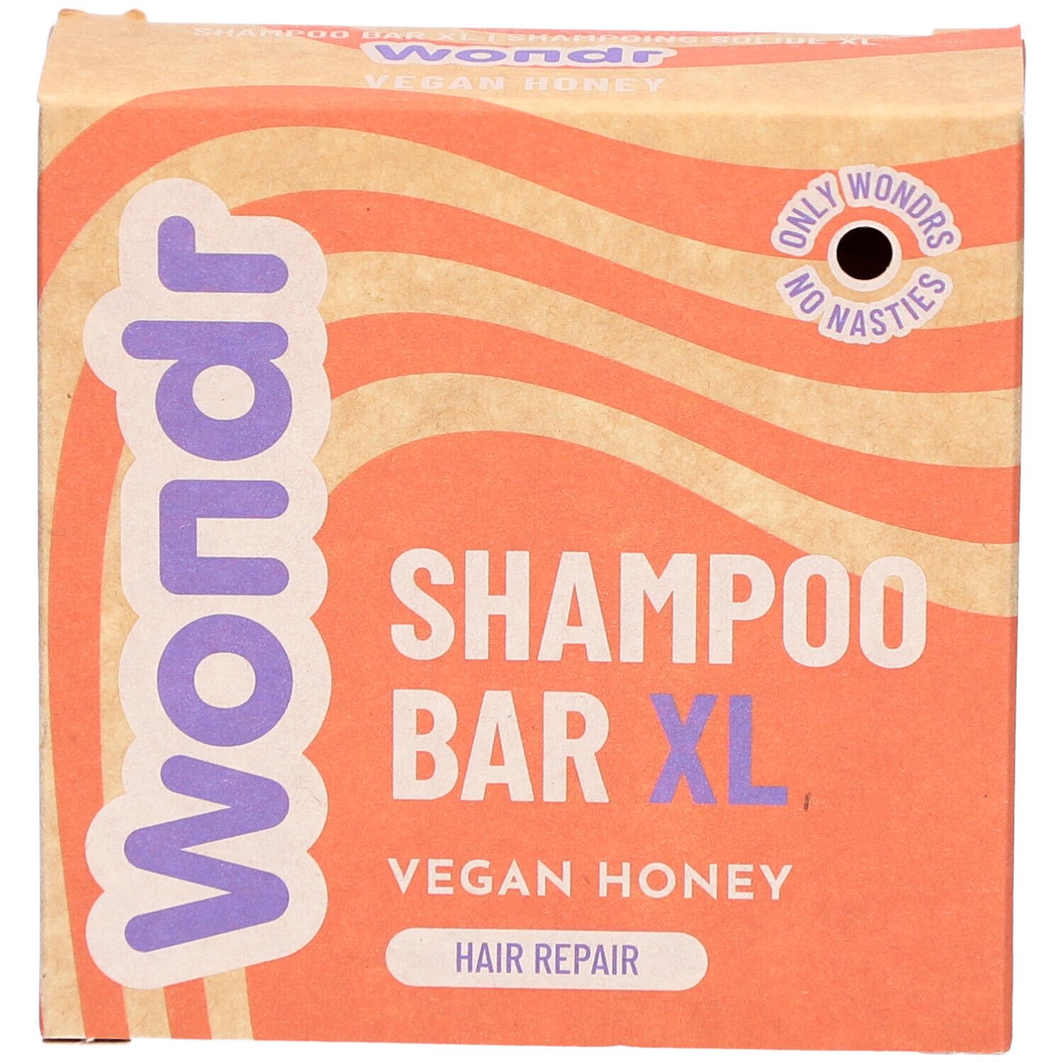 Kartonnen verpakking met Wondr, Shampoo Bar XL, Vegan Honey. Oranje en beige golfachtergrond.