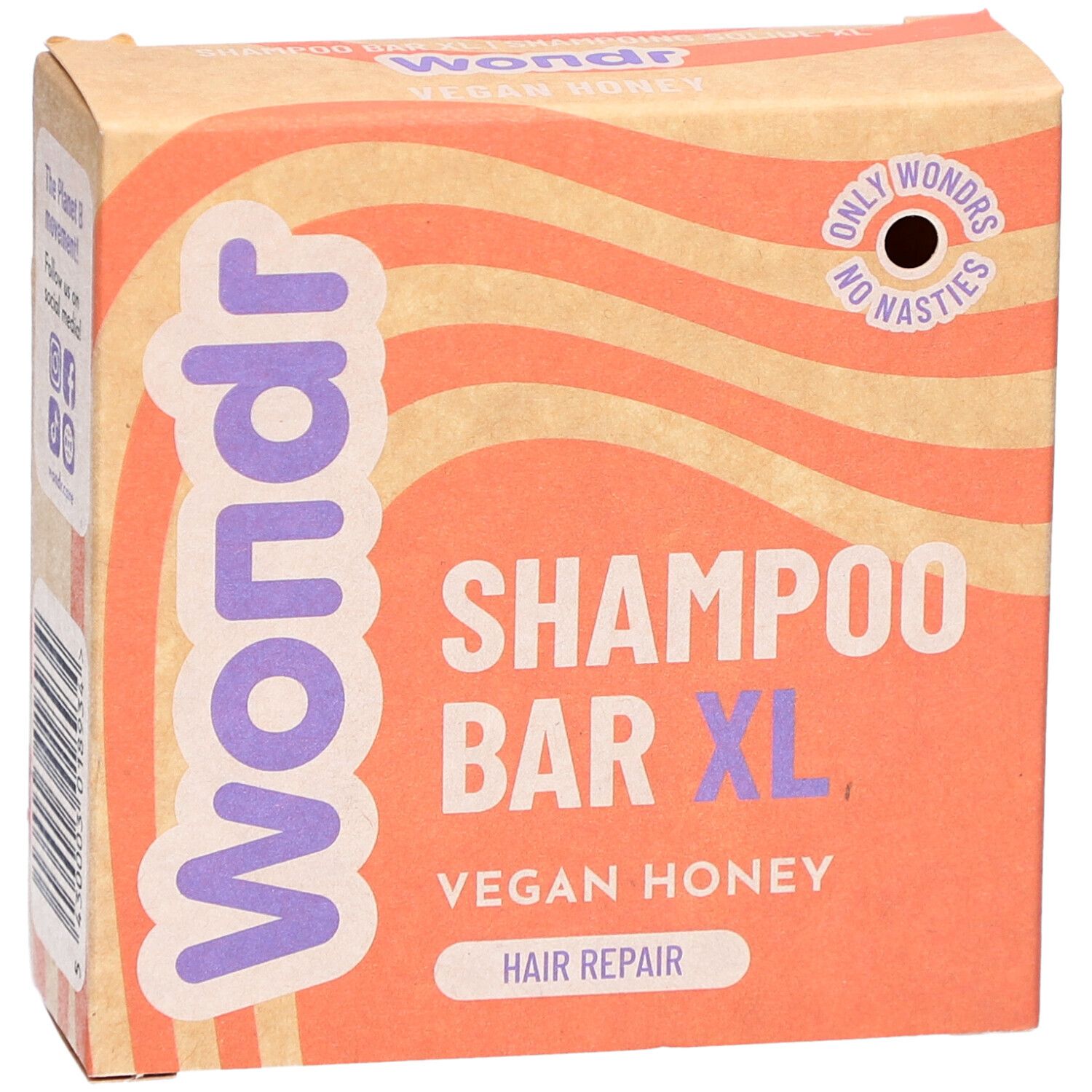 Kartonnen verpakking met Wondr, Shampoo Bar XL, Vegan Honey. Oranje en beige golfachtergrond.