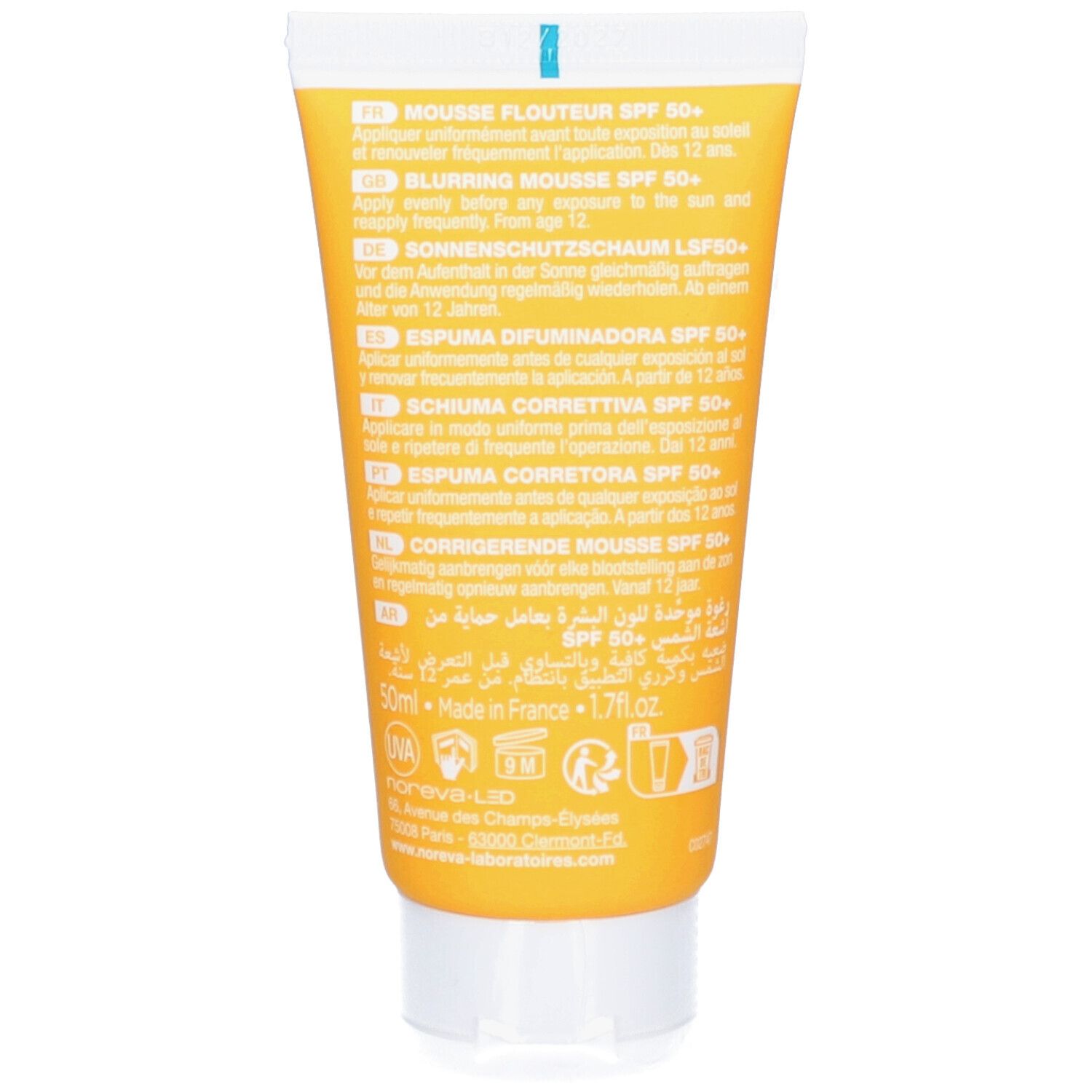 Dos d'un tube jaune. Texte multilingue. Inscription : Mousse Flouteur SPF 50+, Blurring Mousse SPF 50+, Sonnenschutzschaum LSF50+.