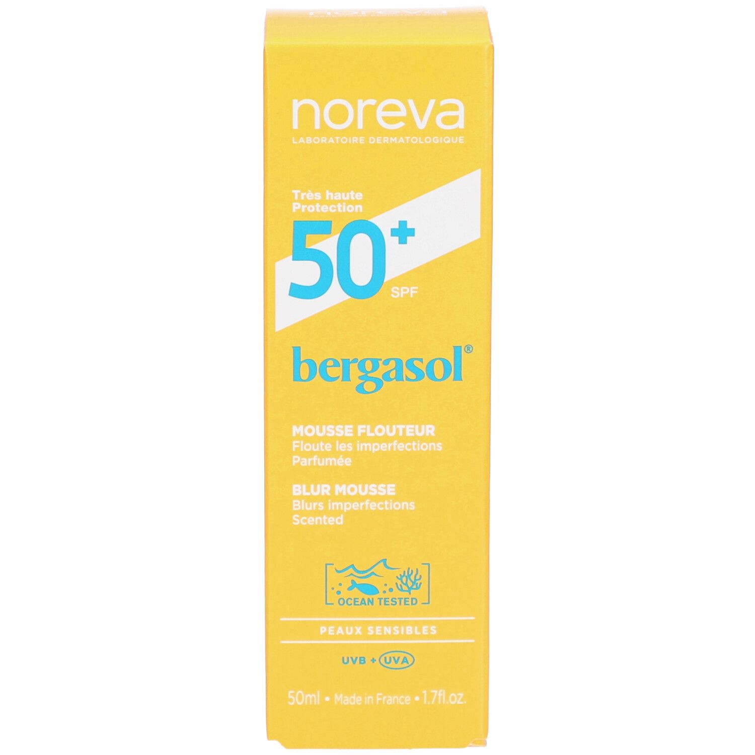 Boîte jaune. Inscription : Noreva, 50+ SPF, bergasol, Mousse Flouteur, Blur Mousse, Peaux Sensibles. Avec logo 'Ocean Tested'.