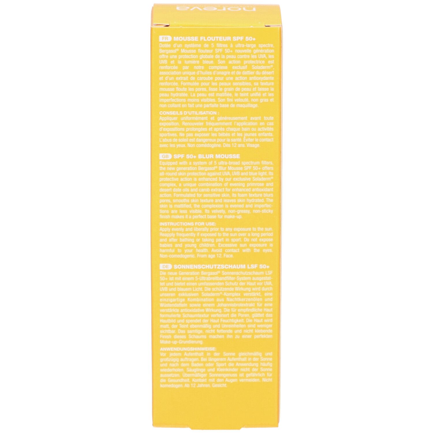 Côté d'une boîte jaune. Texte multilingue. Inscription : Mousse Flouteur SPF 50+, Blurring Mousse SPF 50+, Sonnenschutzschaum LSF50+.