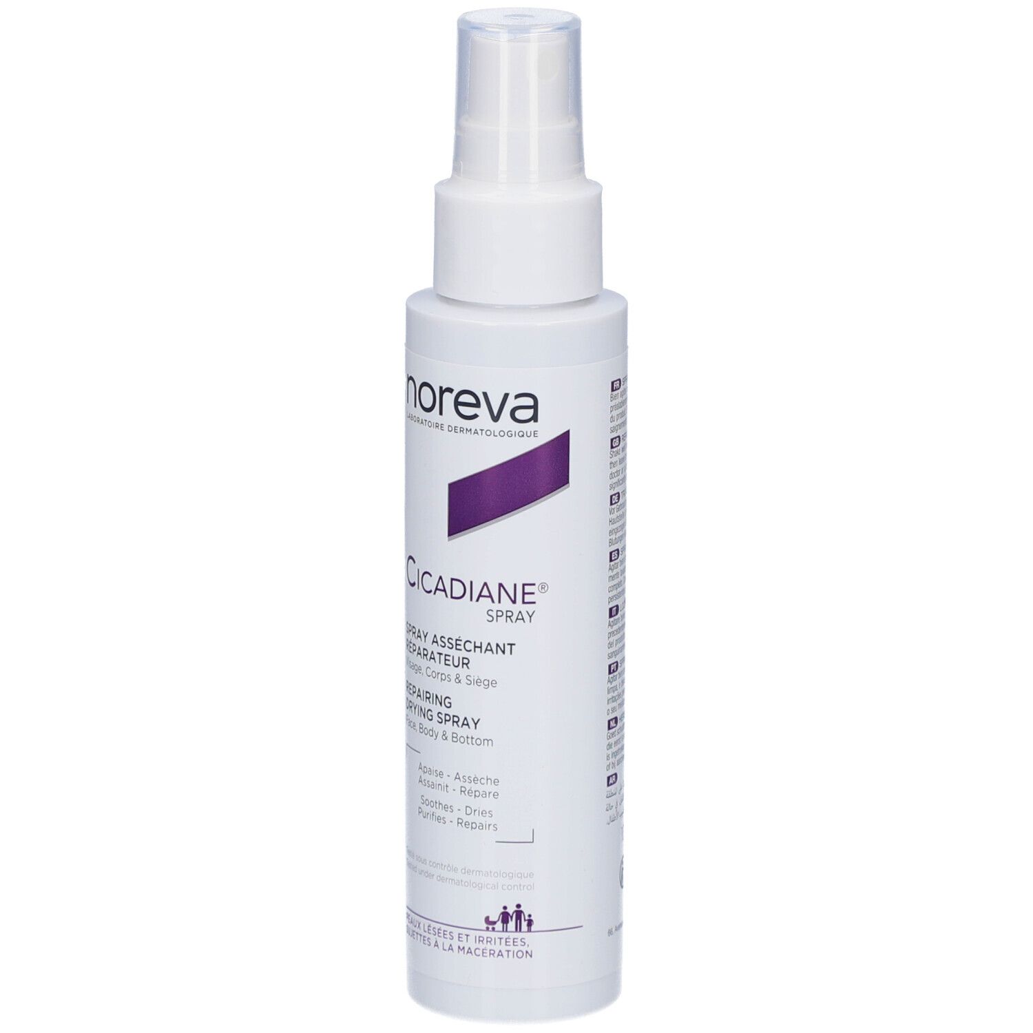 Flacon spray blanc avec accent violet. Texte: Noreva, Cicadiane Spray. Pour visage, corps et siège. Asséchant, réparateur.