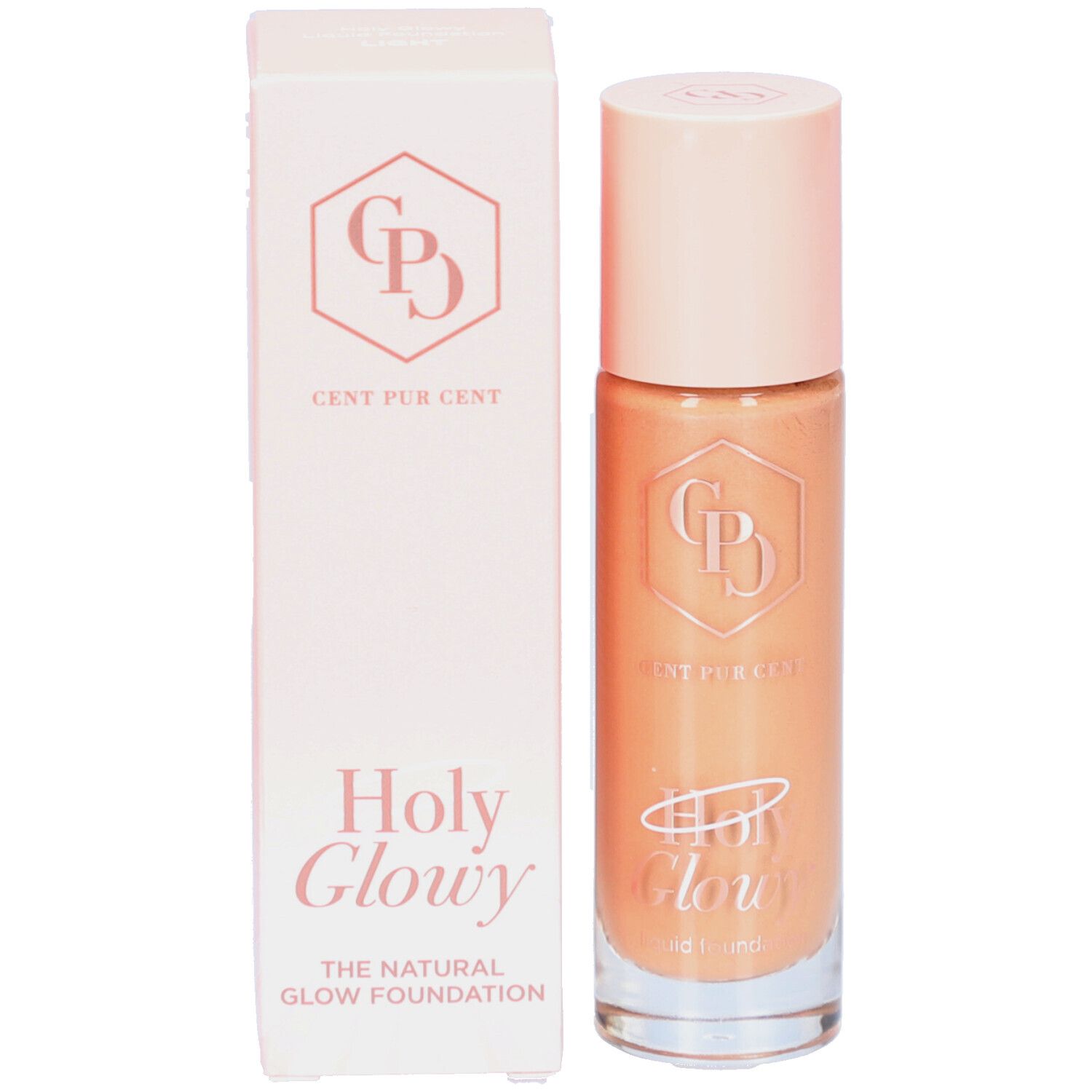 Fond de teint et emballage. Inscription: Cent Pur Cent, Holy Glowy. Liquide clair, doré.