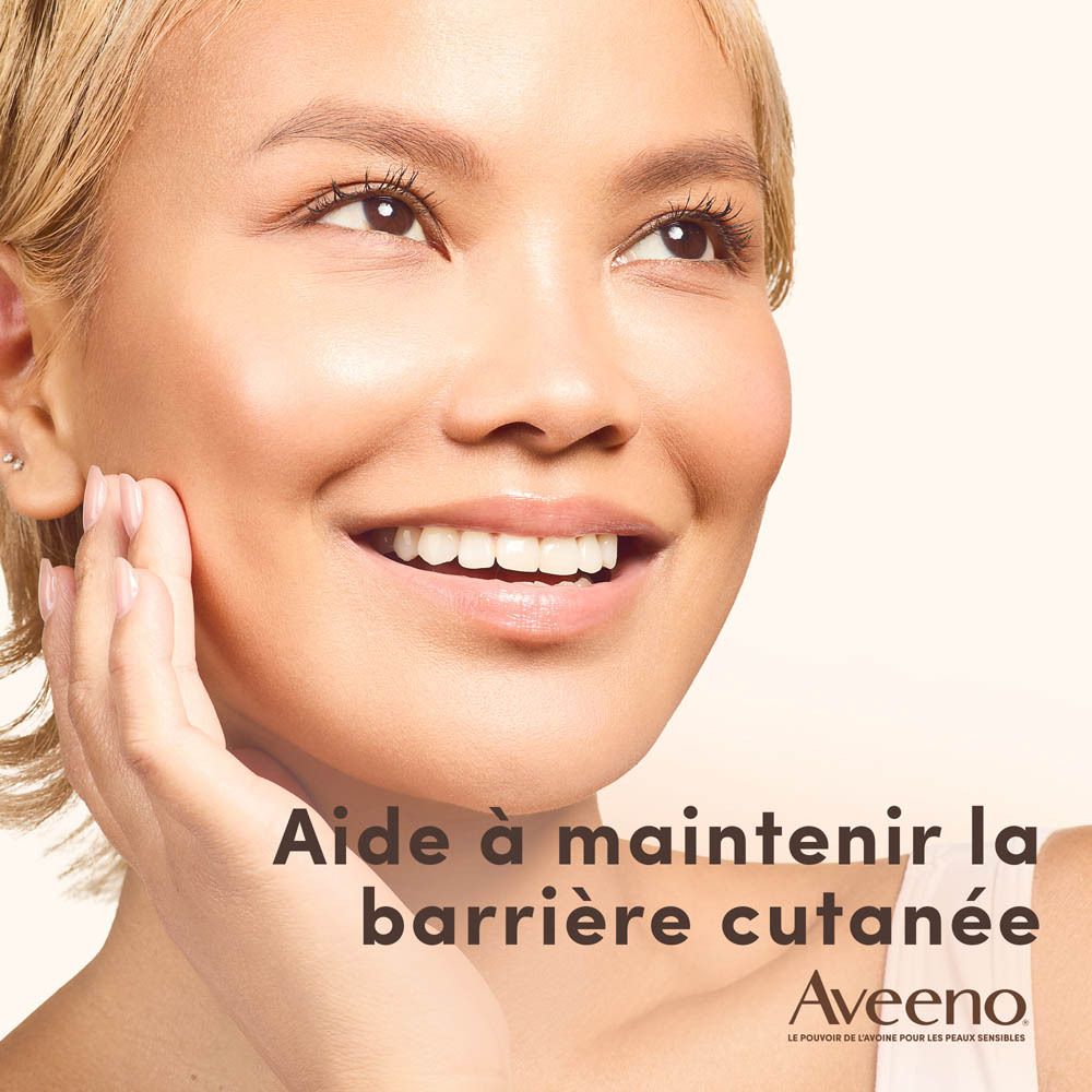 Femme se touche le visage. Logo Aveeno Calm+Restore.