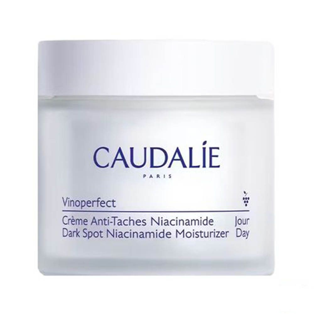 Pot de crème blanc. Inscriptions CAUDALIE, Vinoperfect, Crème Anti-Taches Niacinamide, Dark Spot Niacinamide Moisturizer.
