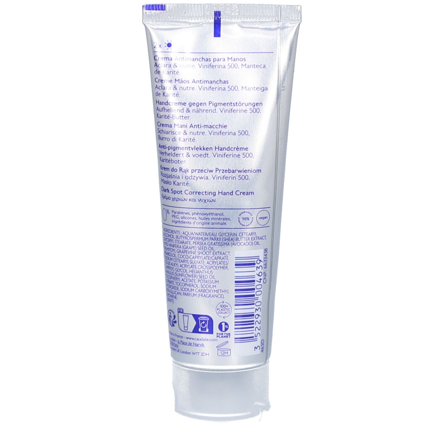 Achterkant van de crème tube. Meertalige productinformatie. Witte achtergrond. Blauwe tekst.