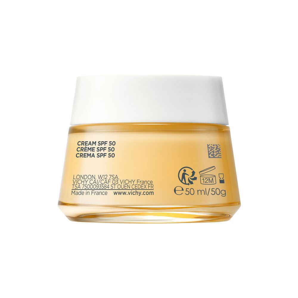 Pot de crème avec couvercle blanc. Dos avec informations et codes. Crème jaunâtre visible.