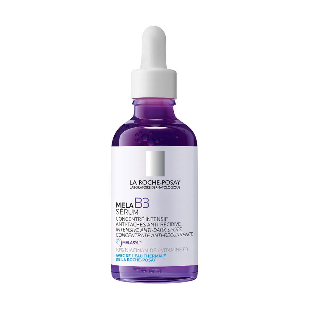 Paarse fles Mela B3 Serum. Met pipet. Tekst: Mela B3 Serum, anti-vlekken.