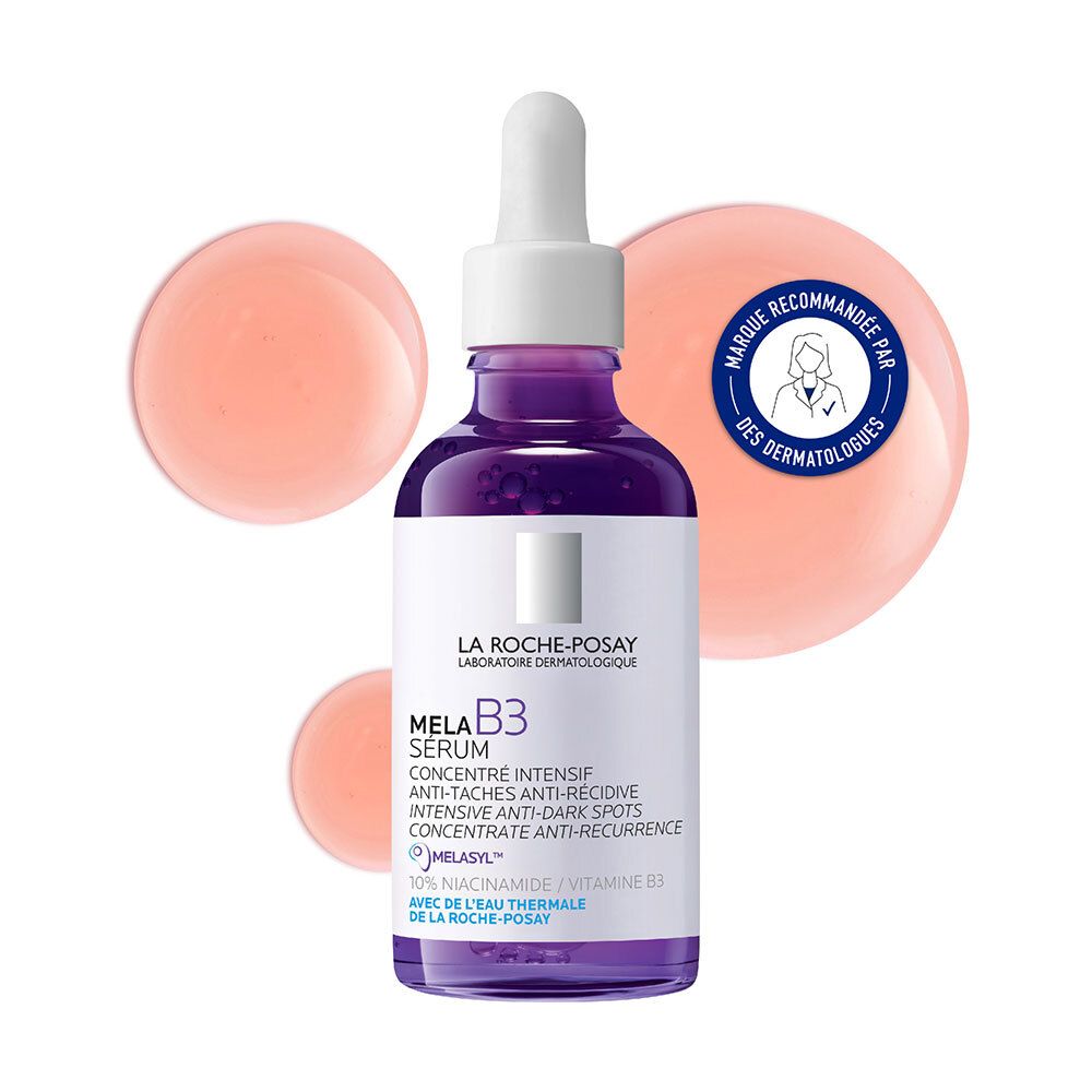 Mela B3 Serum La Roche-Posay. Paarse fles met pipet. Roze druppels op de achtergrond.