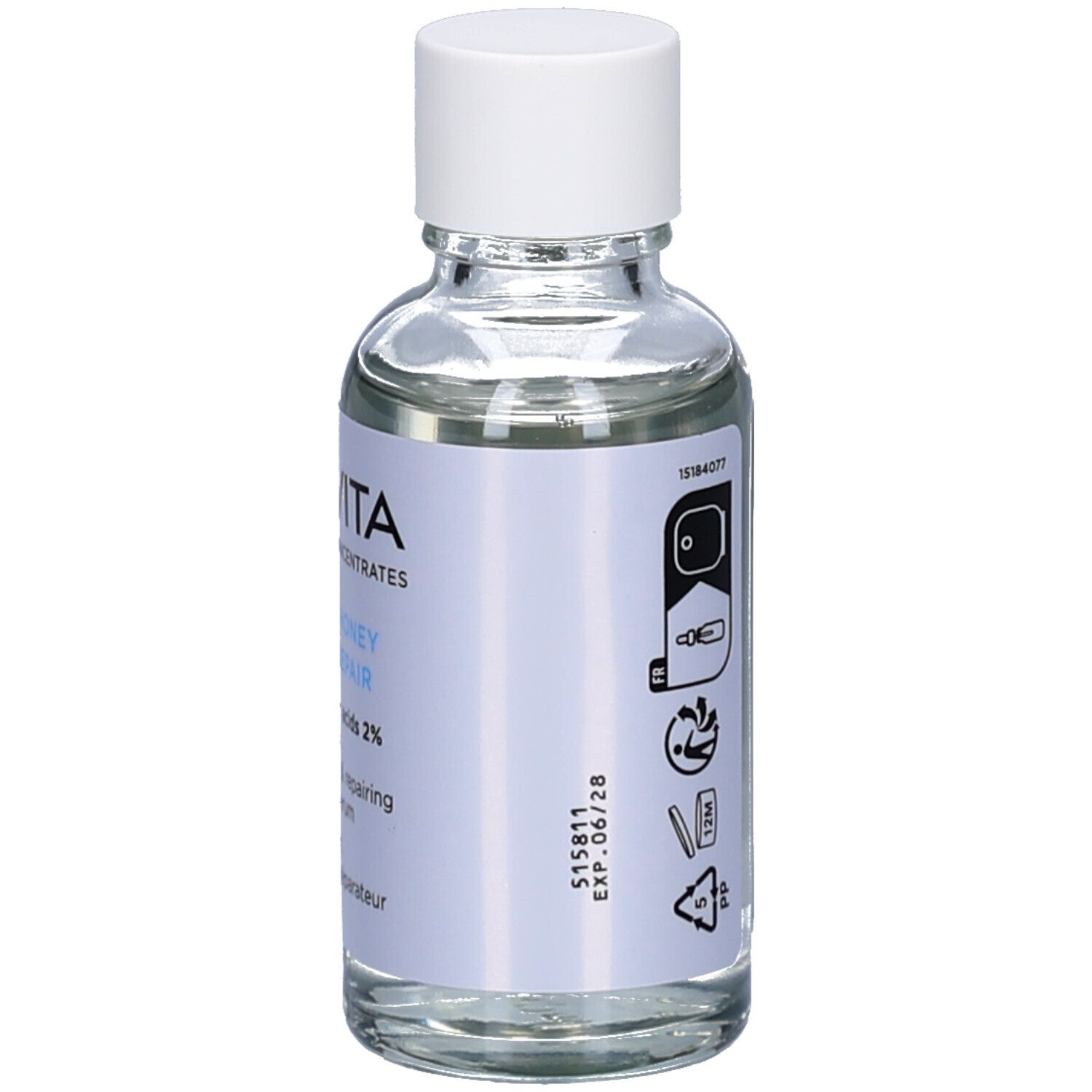 Dos du flacon en verre. Contient des informations sur l'utilisation, l'adresse du fabricant et le volume. Apivita HA5 Honey Repair Sérum.