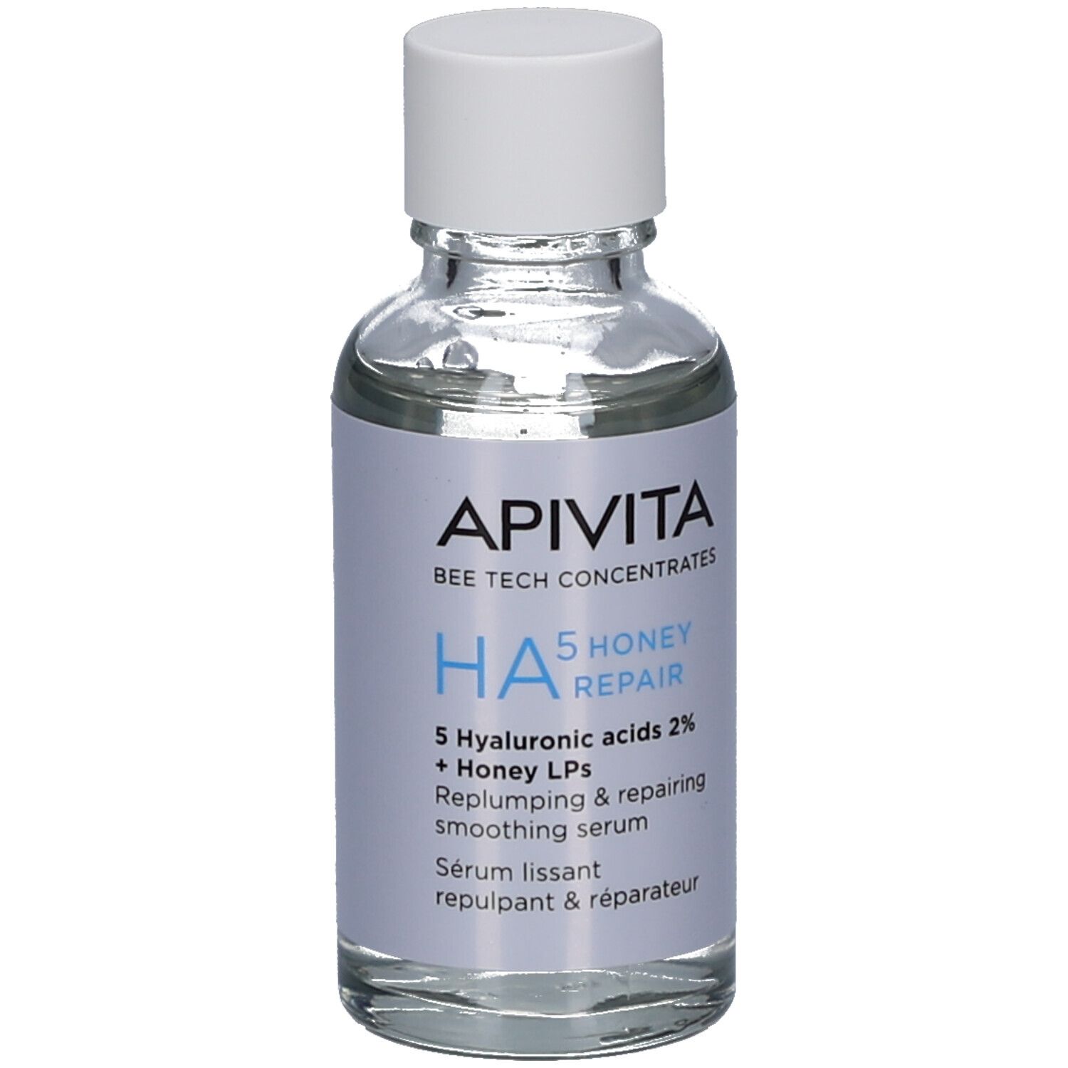 Flacon en verre transparent avec bouchon blanc. Étiquette avec nom du produit, marque Apivita et ingrédients. HA5 Honey Repair Sérum.
