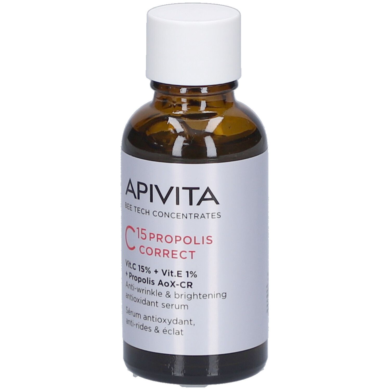Flacon en verre brun avec bouchon blanc. Étiquette avec nom du produit et ingrédients. Marque : Apivita.