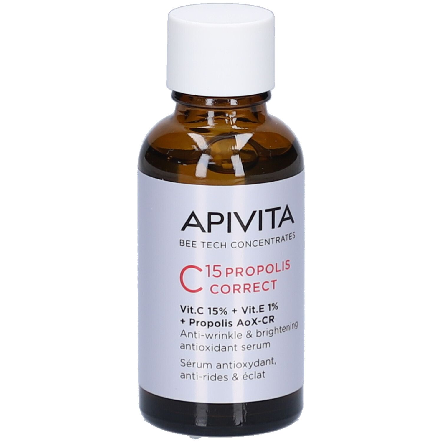 Flacon en verre brun avec bouchon blanc. Étiquette avec nom du produit et ingrédients. Marque : Apivita.