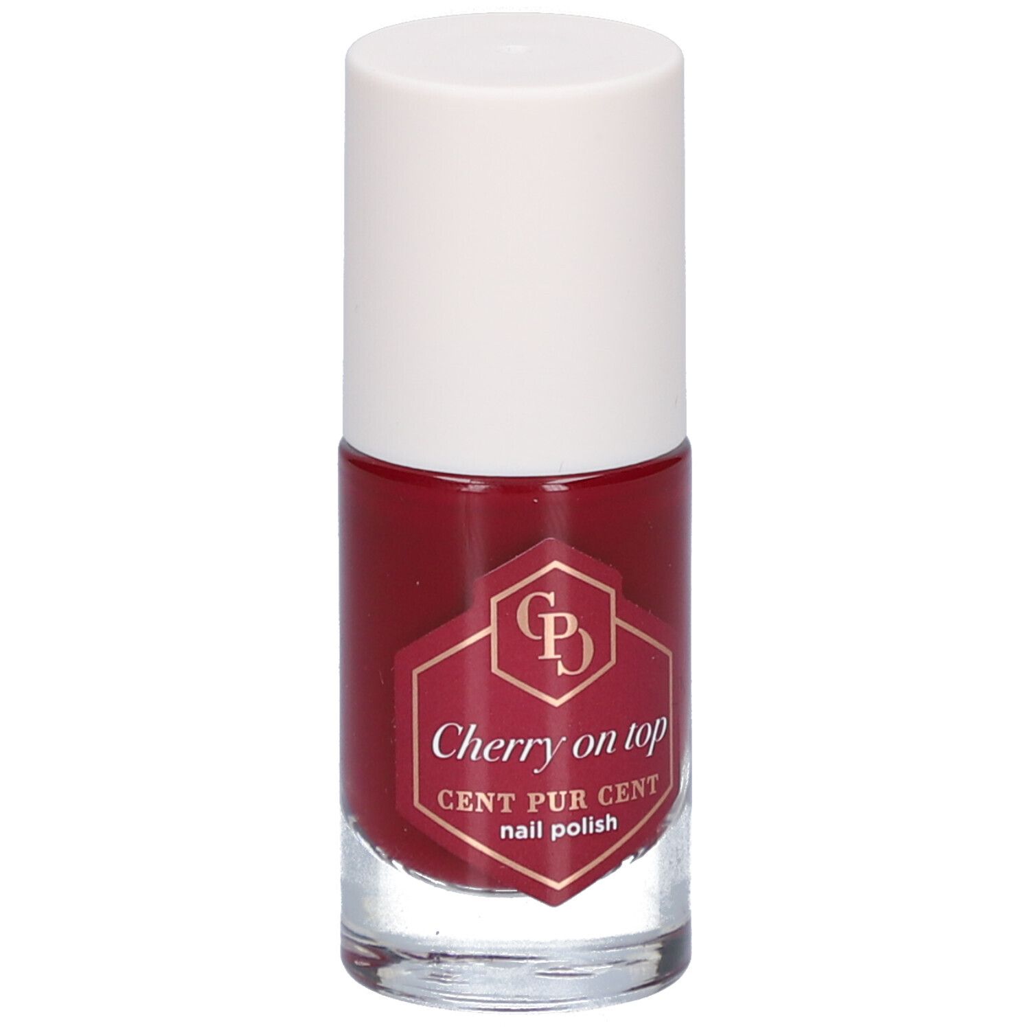 Flacon de vernis à ongles rouge avec bouchon blanc. L'étiquette indique "Cherry on top" et "CENT PUR CENT nail polish".