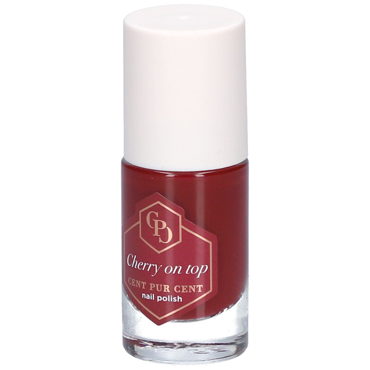 Flacon de vernis à ongles rouge avec bouchon blanc. L'étiquette indique "Cherry on top" et "CENT PUR CENT nail polish".