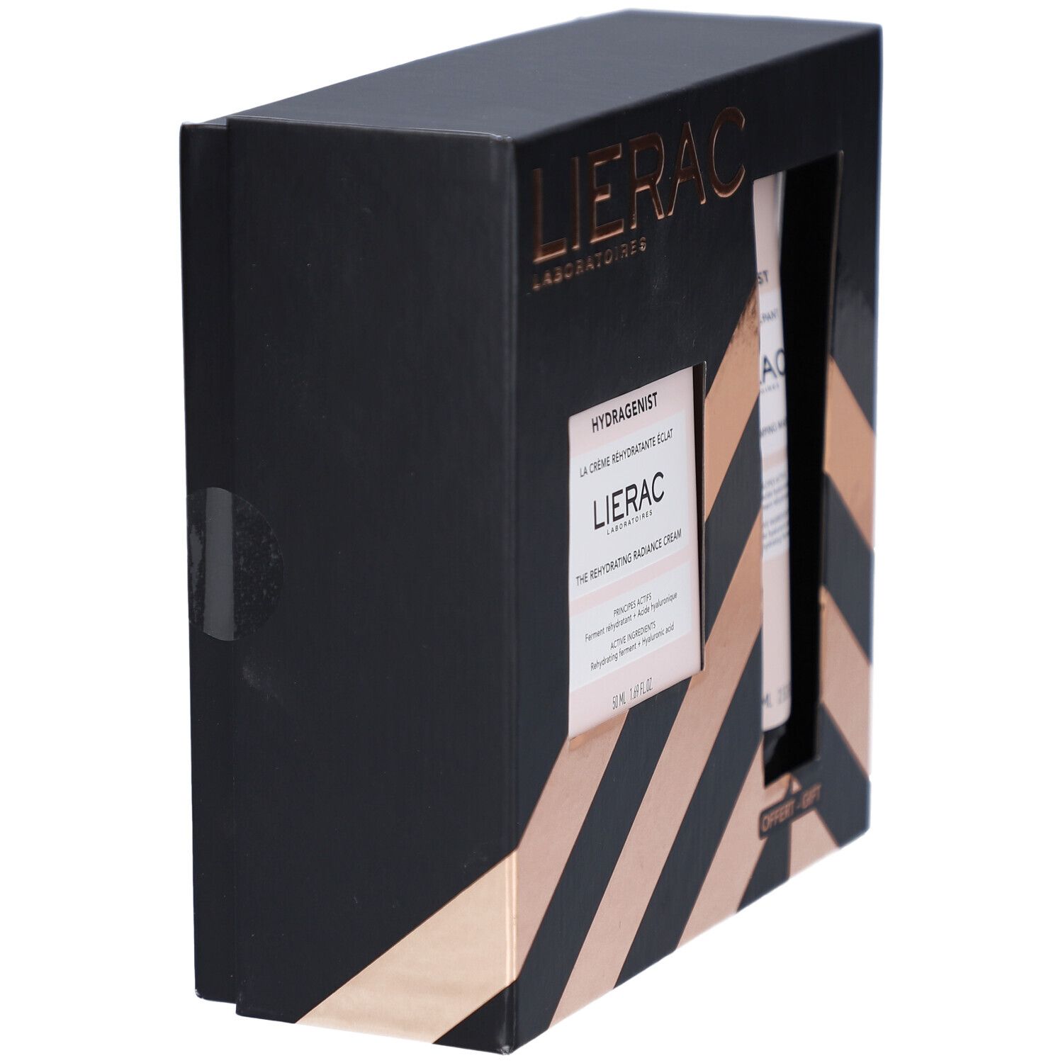 Coffret cadeau noir avec rayures diagonales dorées. Contient des produits cosmétiques. Vue latérale.