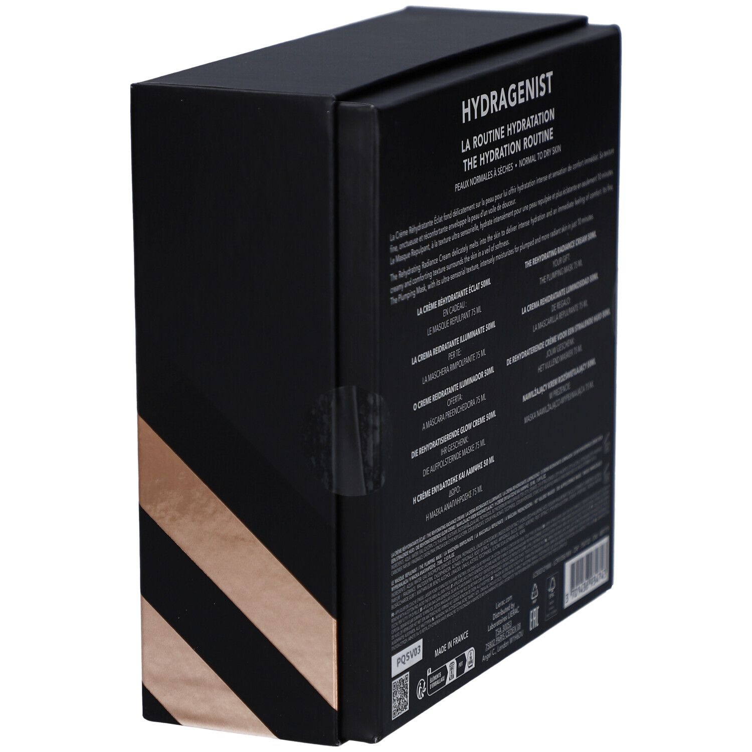 Vue latérale d'un coffret cadeau noir. Texte multilingue. Contient des informations sur les produits.