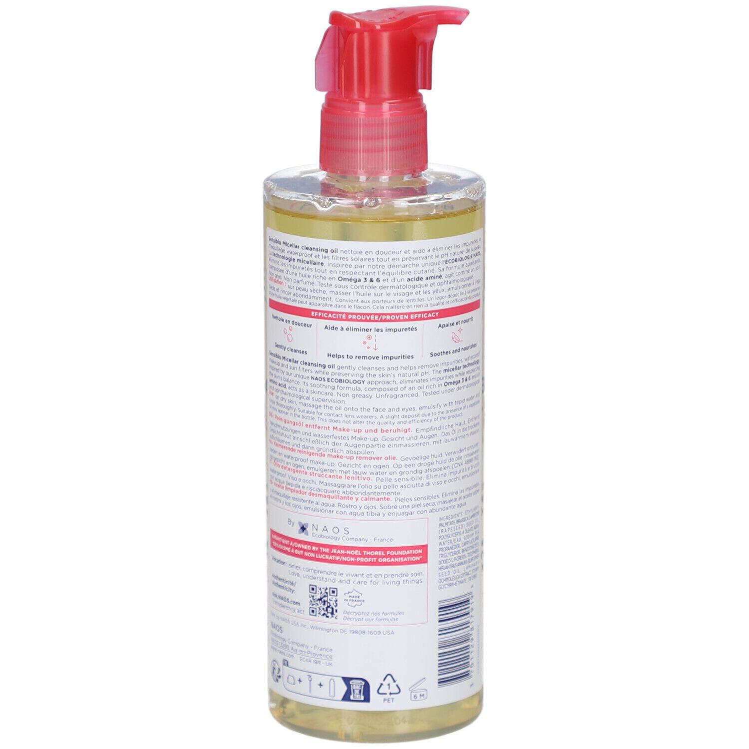 Achterkant van de fles met productinformatie. Rode pompsluiting. Transparante vloeistof.