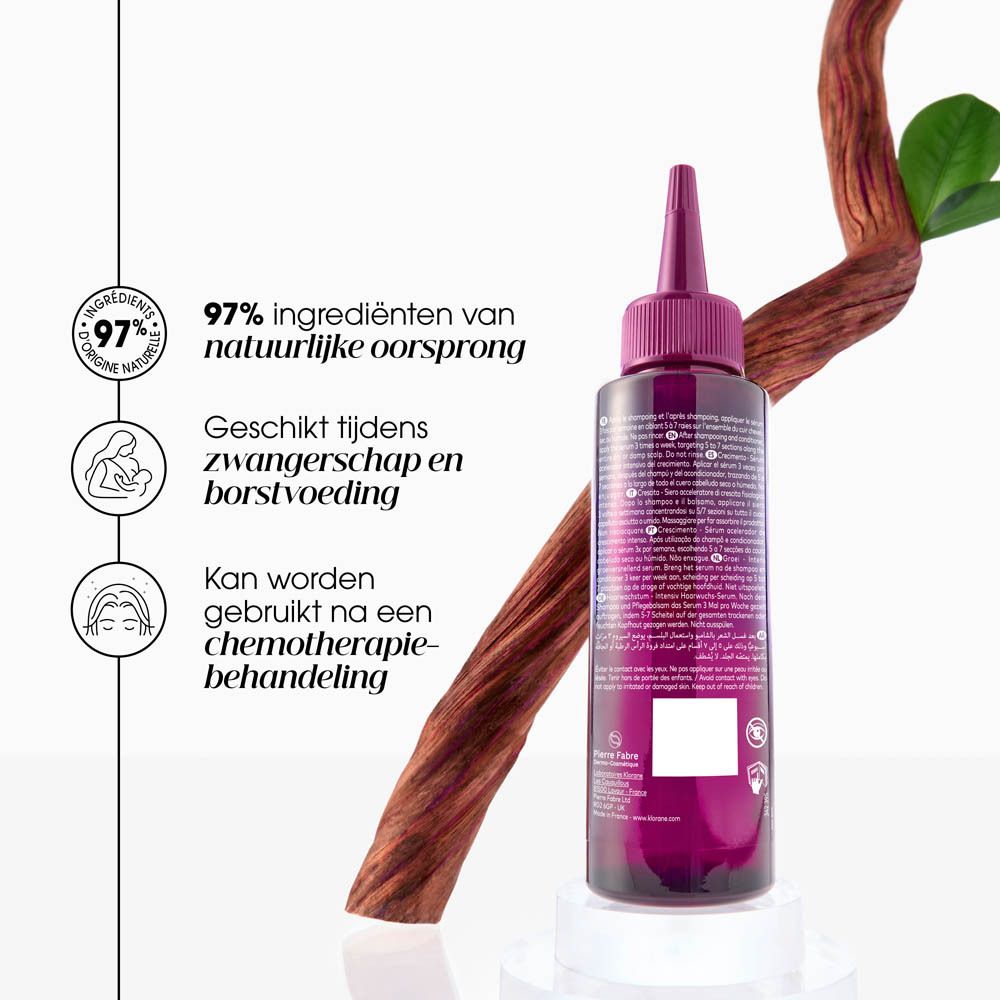 Serumfles en ingrediënten. Fles: donkerrood, met applicator. Tekst: Klorane, Growth. Ingrediënten.