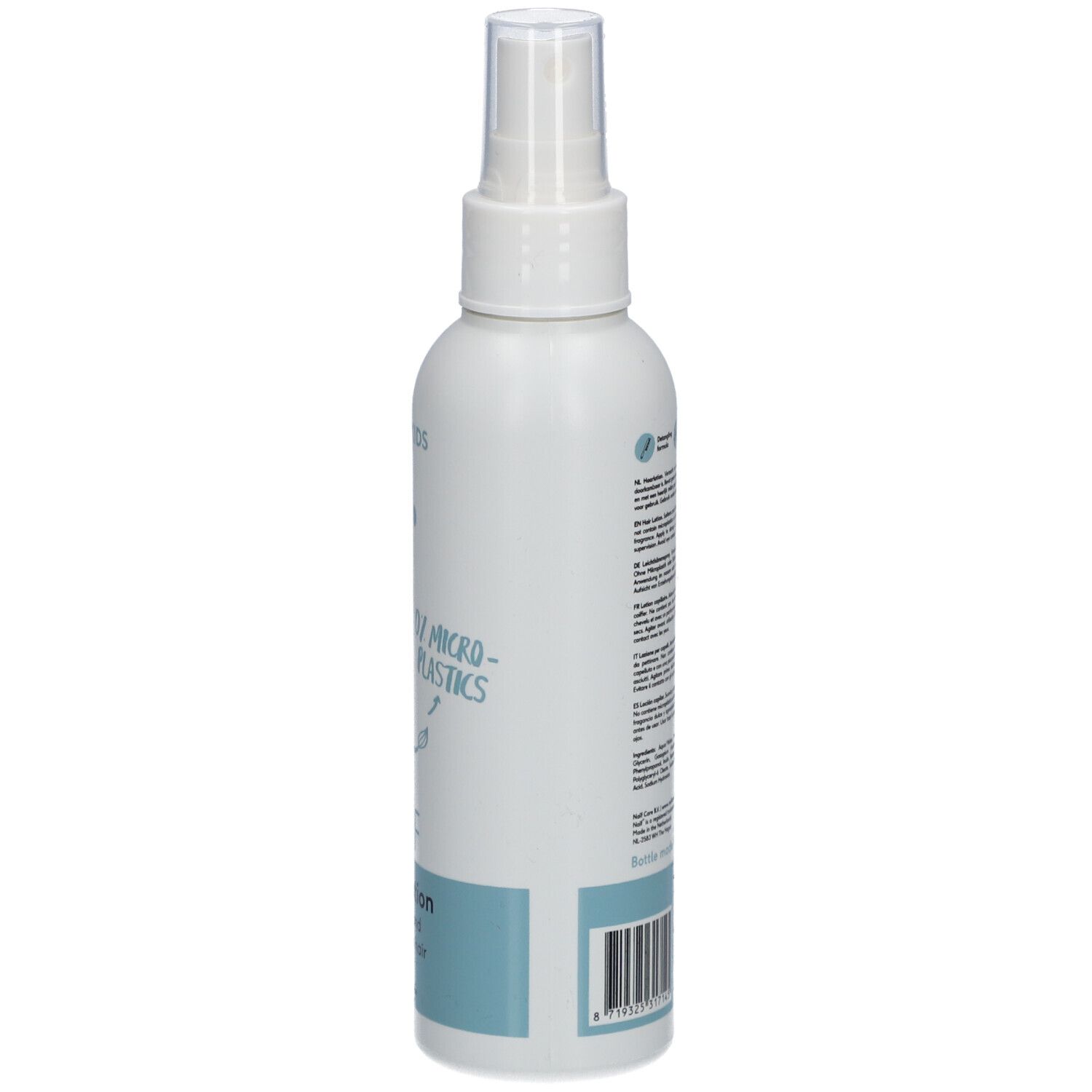 Witte fles met verstuiver. Opschrift: Naïf, Hair Lotion. Tekst op achterkant. Voor baby's en kinderen.