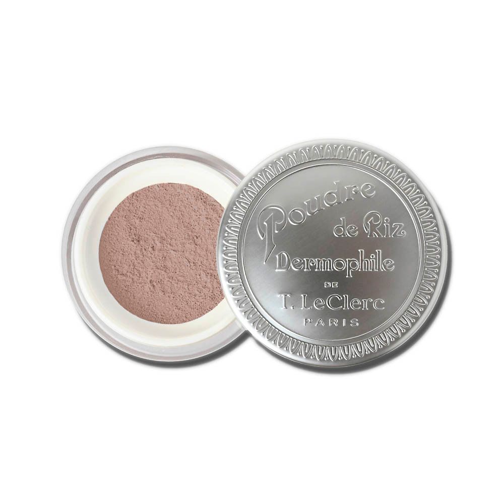 Pot rond argenté avec poudre libre. Couvercle avec logo "Poudre de Riz Dermophile".