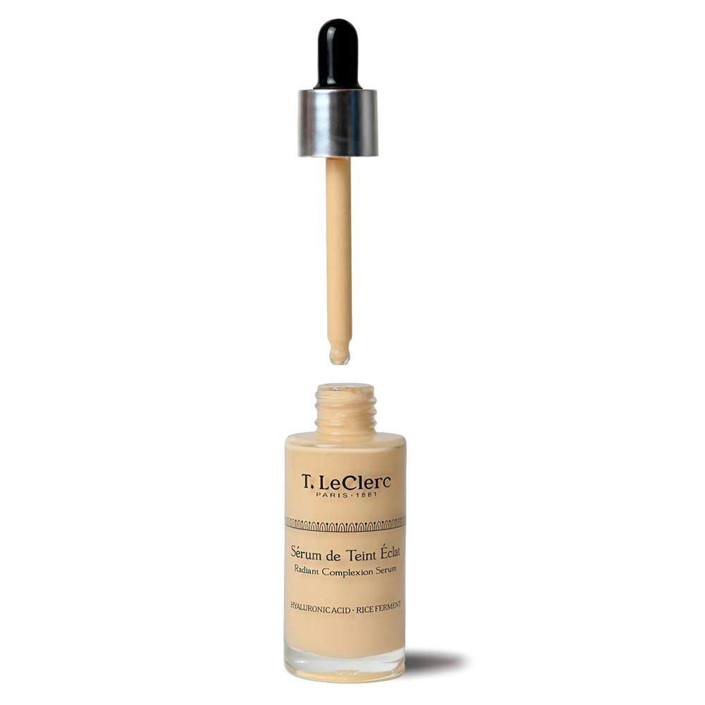 T.LeClerc serum. Glazen fles met pipet. Pipet uit de fles. Beige vloeistof zichtbaar.
