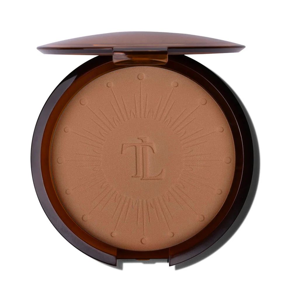 T. LeClerc Bronzing Sun Powder, boîte ouverte. Poudre brune avec logo et design rayons de soleil.