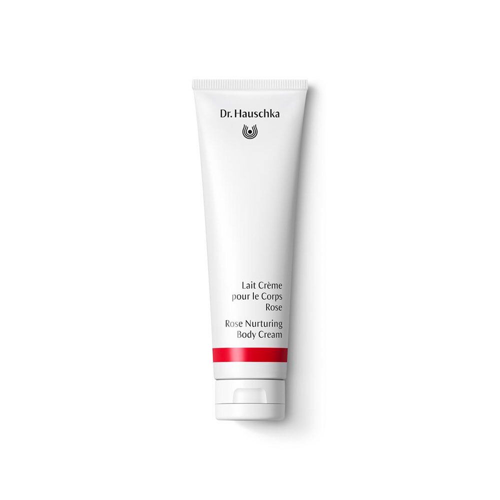 Tube blanc avec bande rouge. Inscription: Dr. Hauschka, Lait Crème pour le Corps Rose, Rose Nurturing Body Cream.